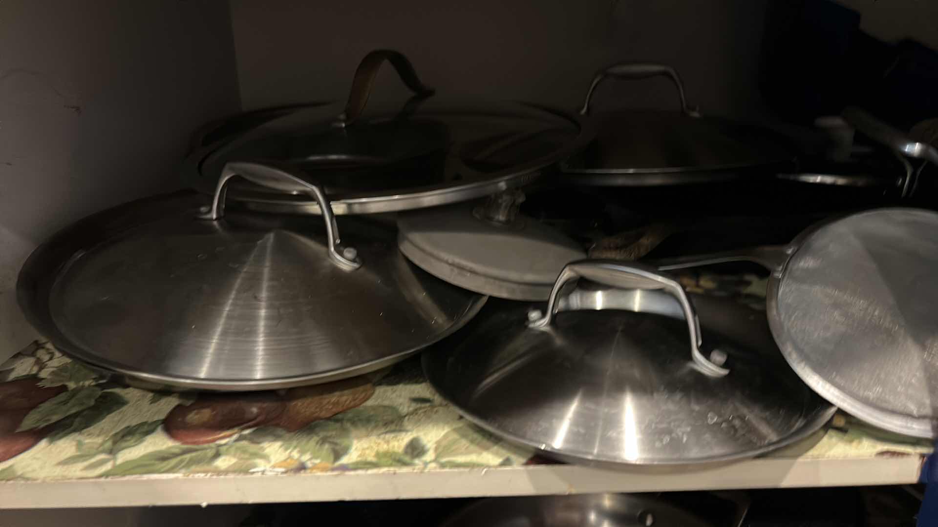 Photo 1 of CONTENTS OF CABINET IN KITCHEN- POTS AND PANS