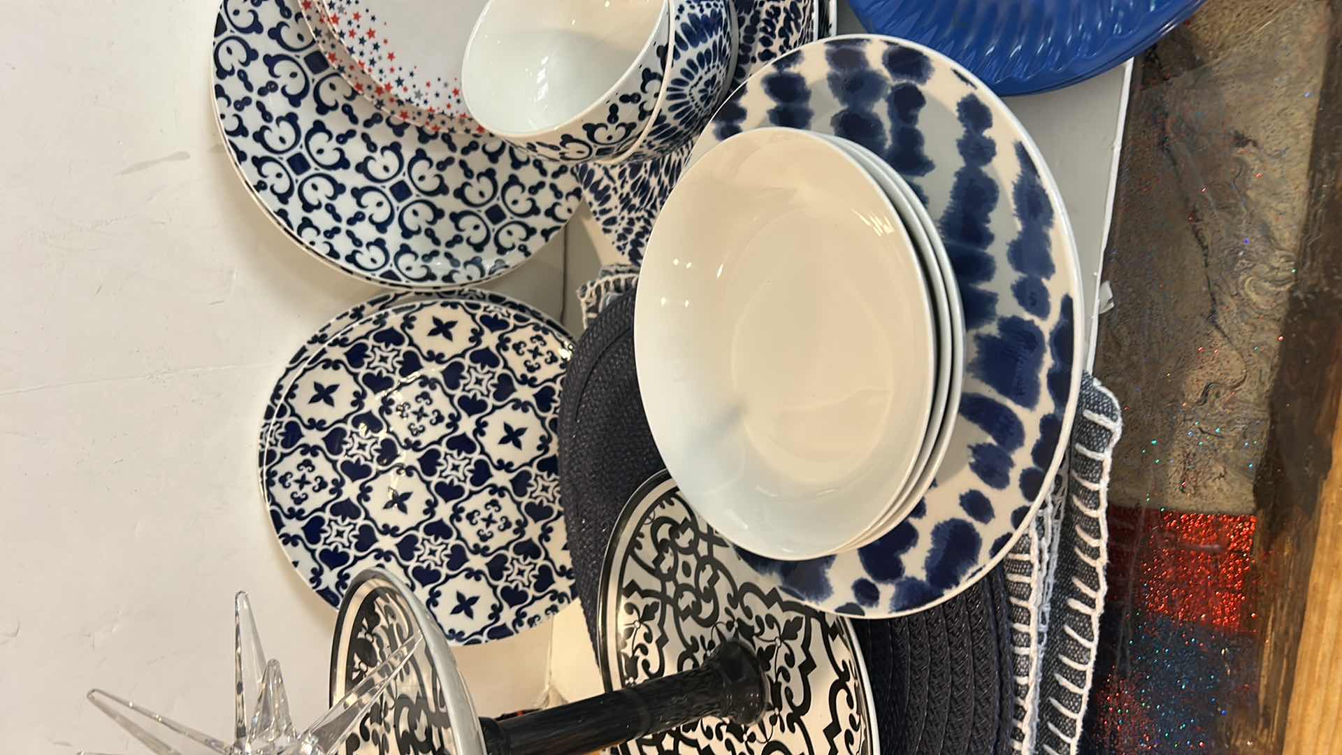 Photo 1 of PLACEMATS, BLUE AND WHITE PLATES, BOWLS AND ACRYLIC STAR