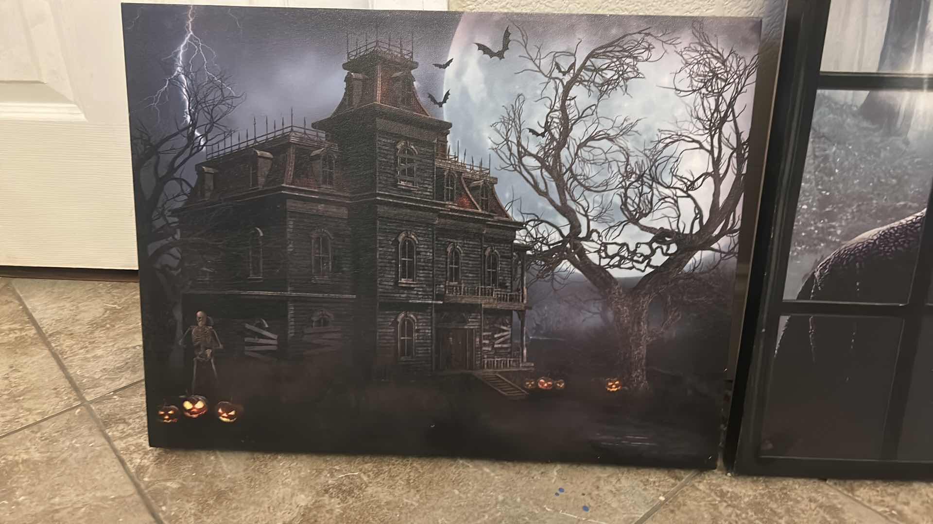 Photo 1 of 2 - STRETCHED CANVAS BATTERY OPERATED LIGHT UP HAUNTED HOUSE & GRIM REEPER ARTWORK FOR HALLOWEEN AND MORE 20” x H15”