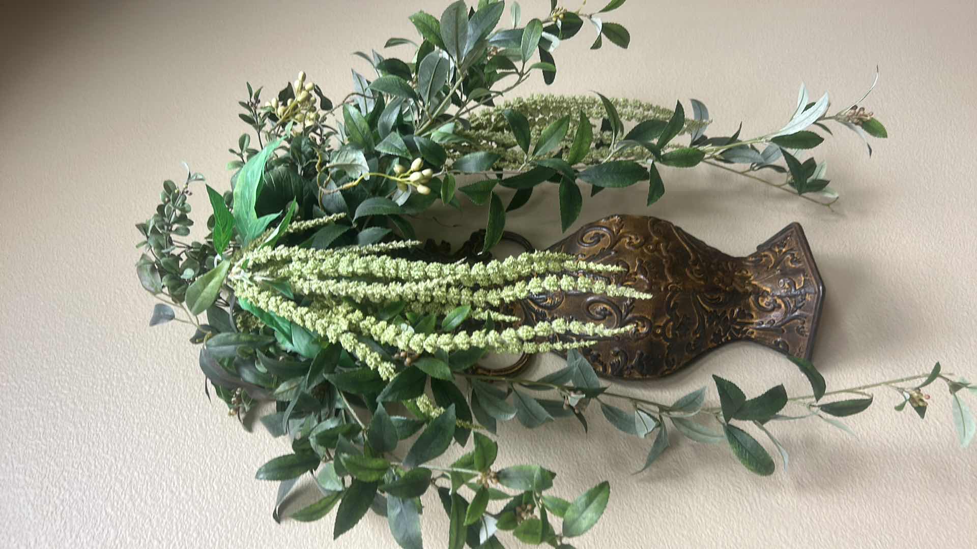 Photo 1 of WALL-MOUNTED BRONZE-FINISH METAL VASE WITH ARTIFICIAL GREEN FOILAGE AND HANGING AMARANTHUS SPRAY H26”