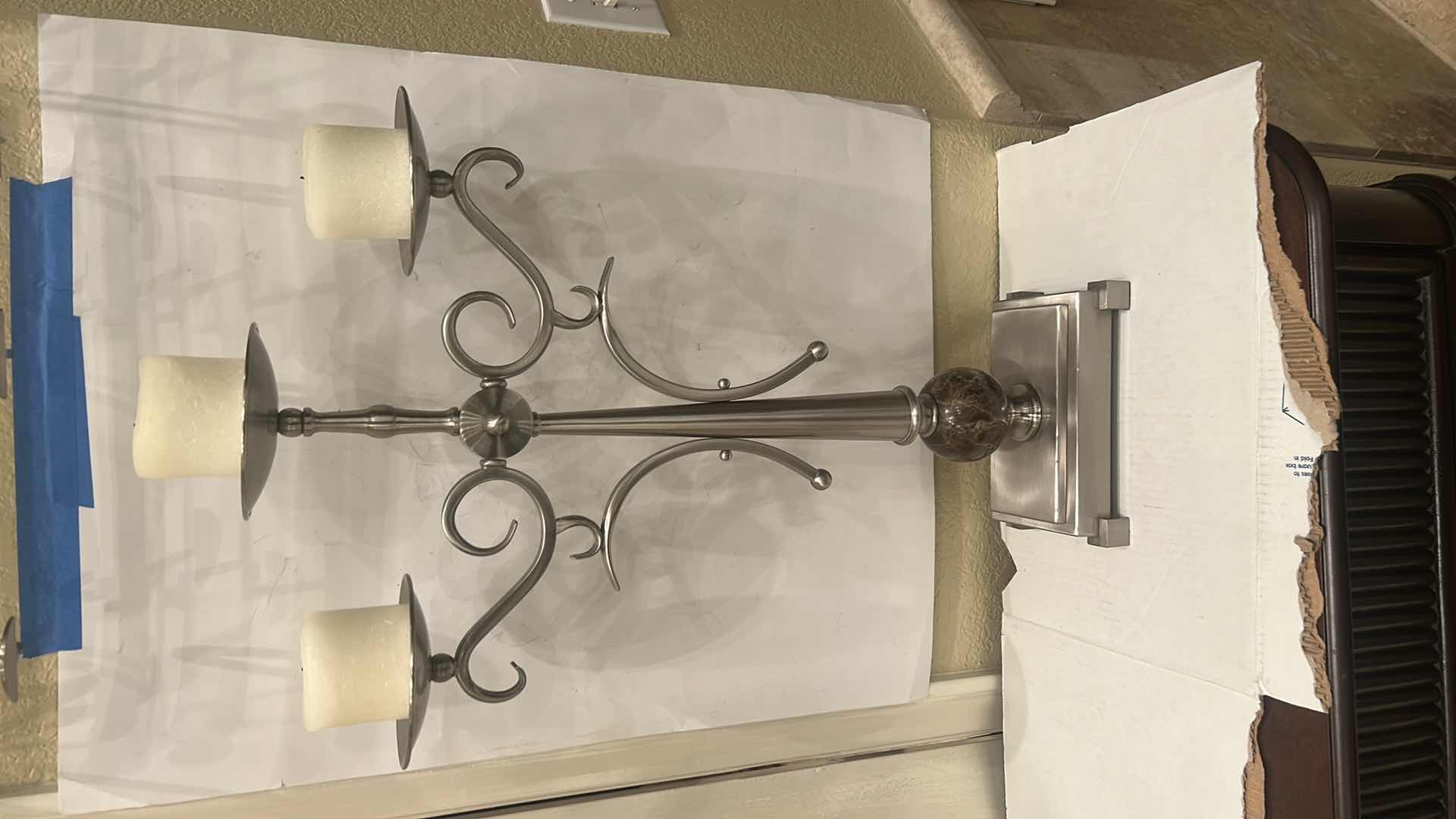 Photo 1 of - METAL THREE-ARM CANDELABRA, POSSIBLY WITH A PEWTER, SILVER, OR BRUSHED METAL FINISH. H26”