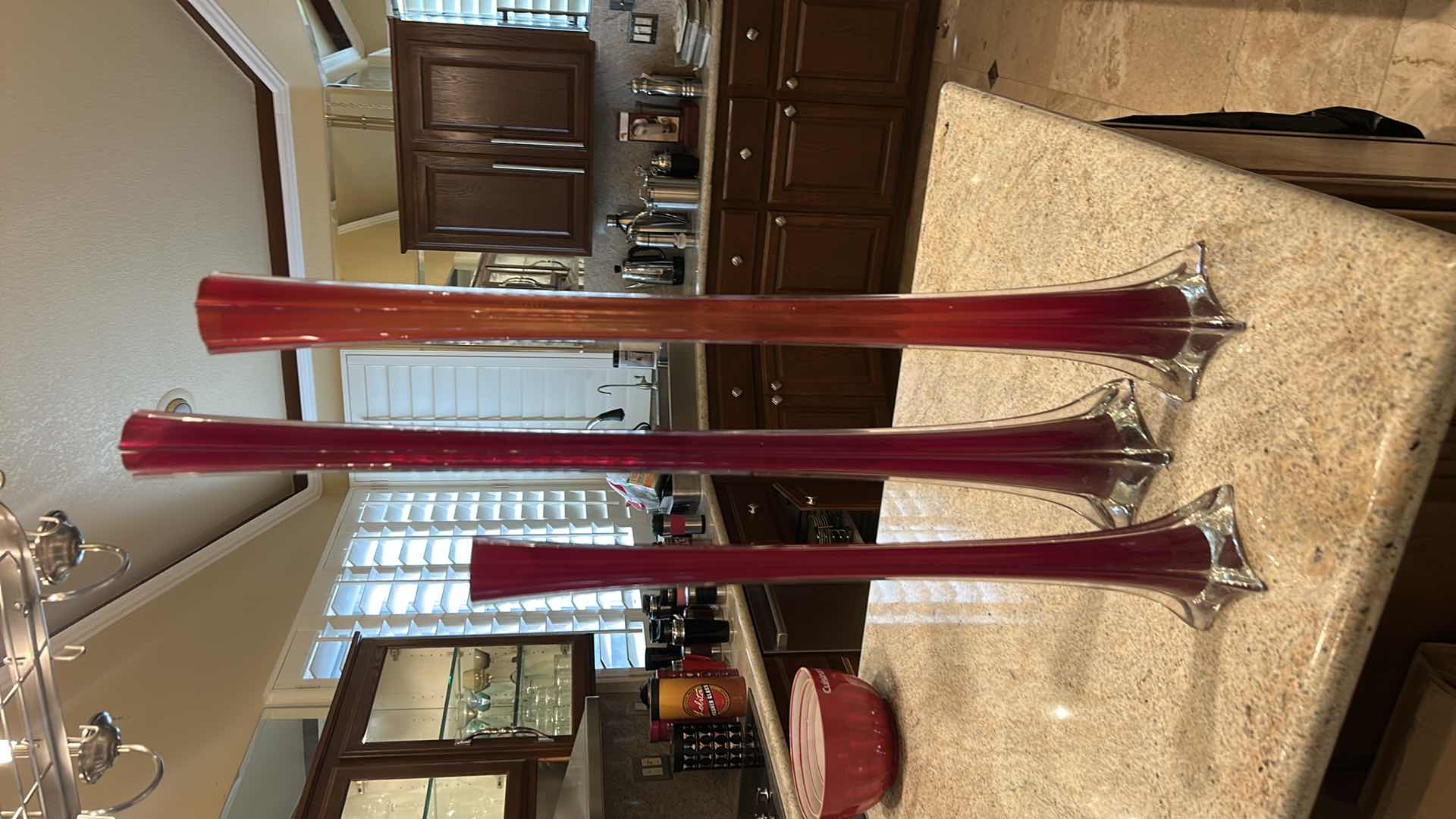 Photo 1 of SET OF VINTAGE MID-CENTURY MODERN RED CASED GLASS “SWUNG” OR “ELEPHANT FOOT” BUD VASES  (TALLEST 35 1/2”)