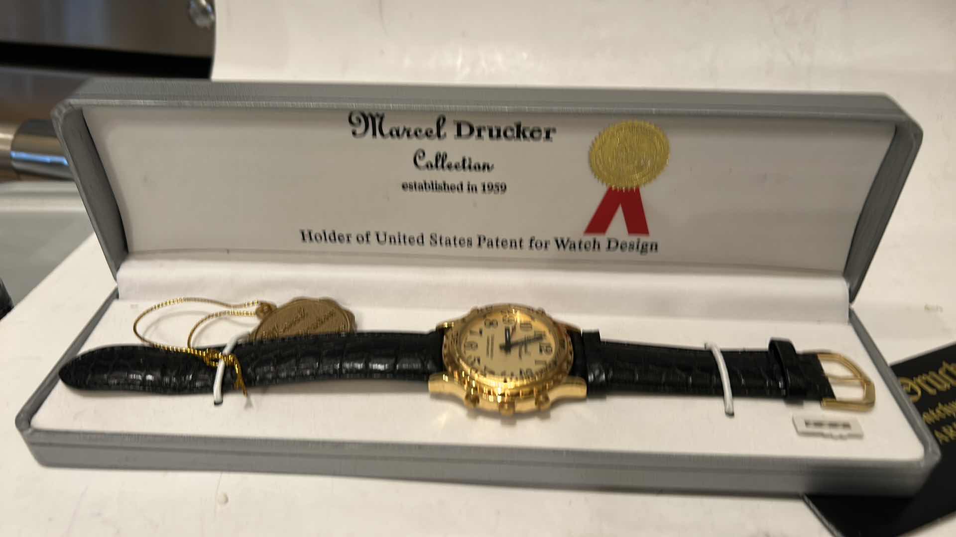 Photo 1 of MARCEL DRUCKER GOLD TONE TALKING WATCH FOR MEN LEATHER BAND