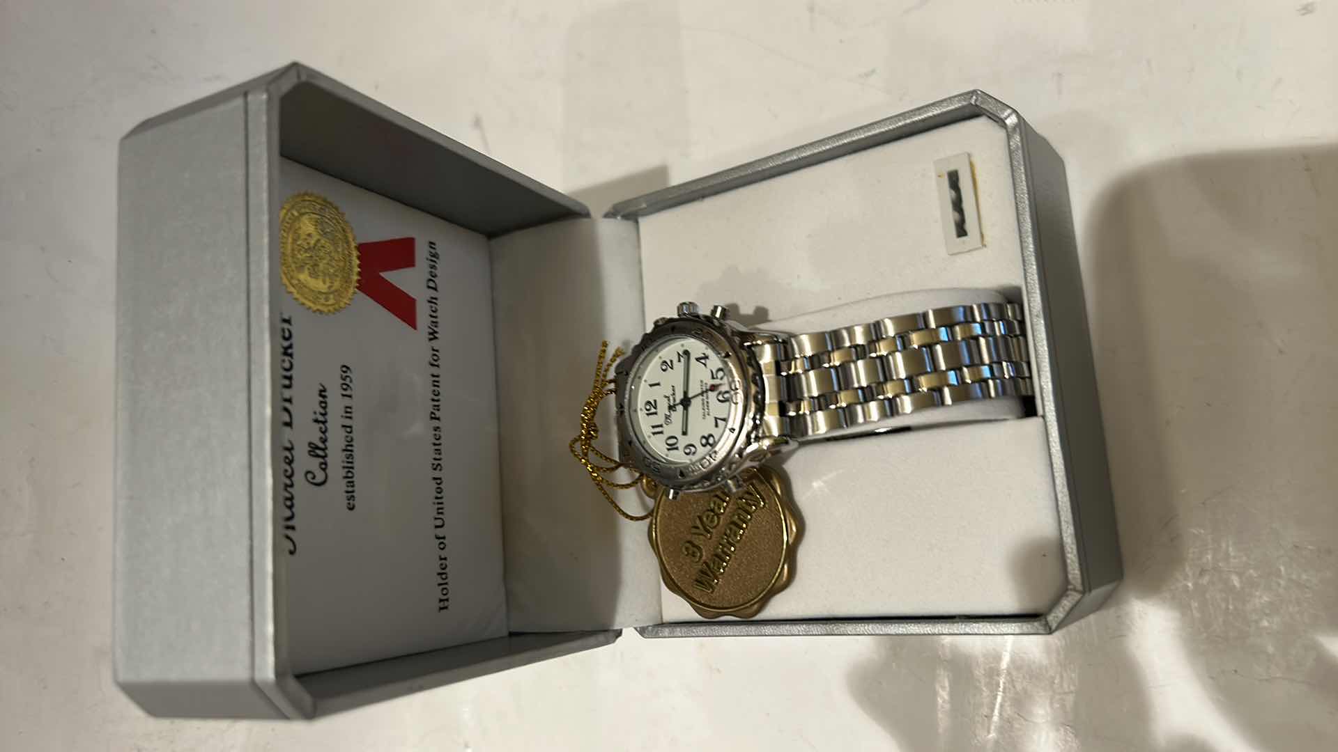 Photo 1 of MARCEL DRUCKER WOMEN’S SILVER 4-BUTTON BRACELET STYLE WATCH