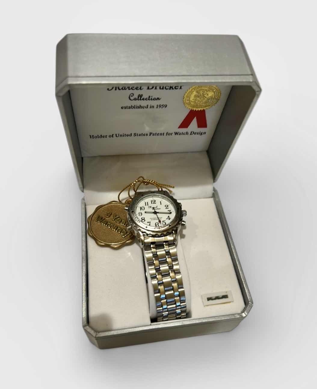 Photo 1 of MARCEL DRUCKER WOMEN’S SILVER 4-BUTTON BRACELET STYLE WATCH