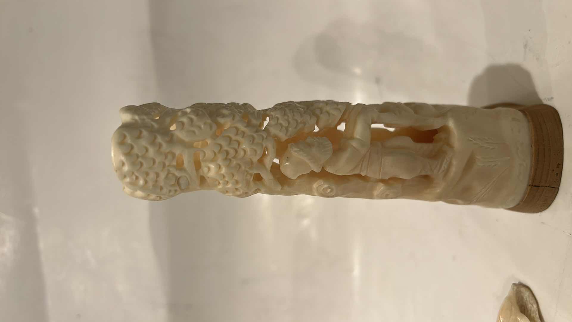 Photo 1 of 2 - IVORY OR BONE INTRICATELY HAND-CARVED AND PIERCED, DEPICTING FIGURES (POSSIBLY DEITIES OR MYTHICAL BEASTS) DOLPHINS AND NATURAL THEMES.
(TALLEST 5 1/2”)