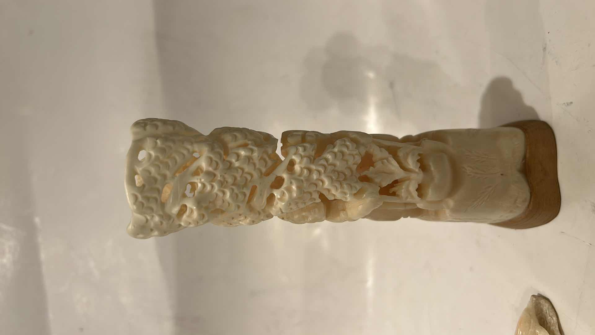 Photo 1 of 2 - IVORY OR BONE INTRICATELY HAND-CARVED AND PIERCED, DEPICTING FIGURES (POSSIBLY DEITIES OR MYTHICAL BEASTS) DOLPHINS AND NATURAL THEMES.
(TALLEST 5 1/2”)