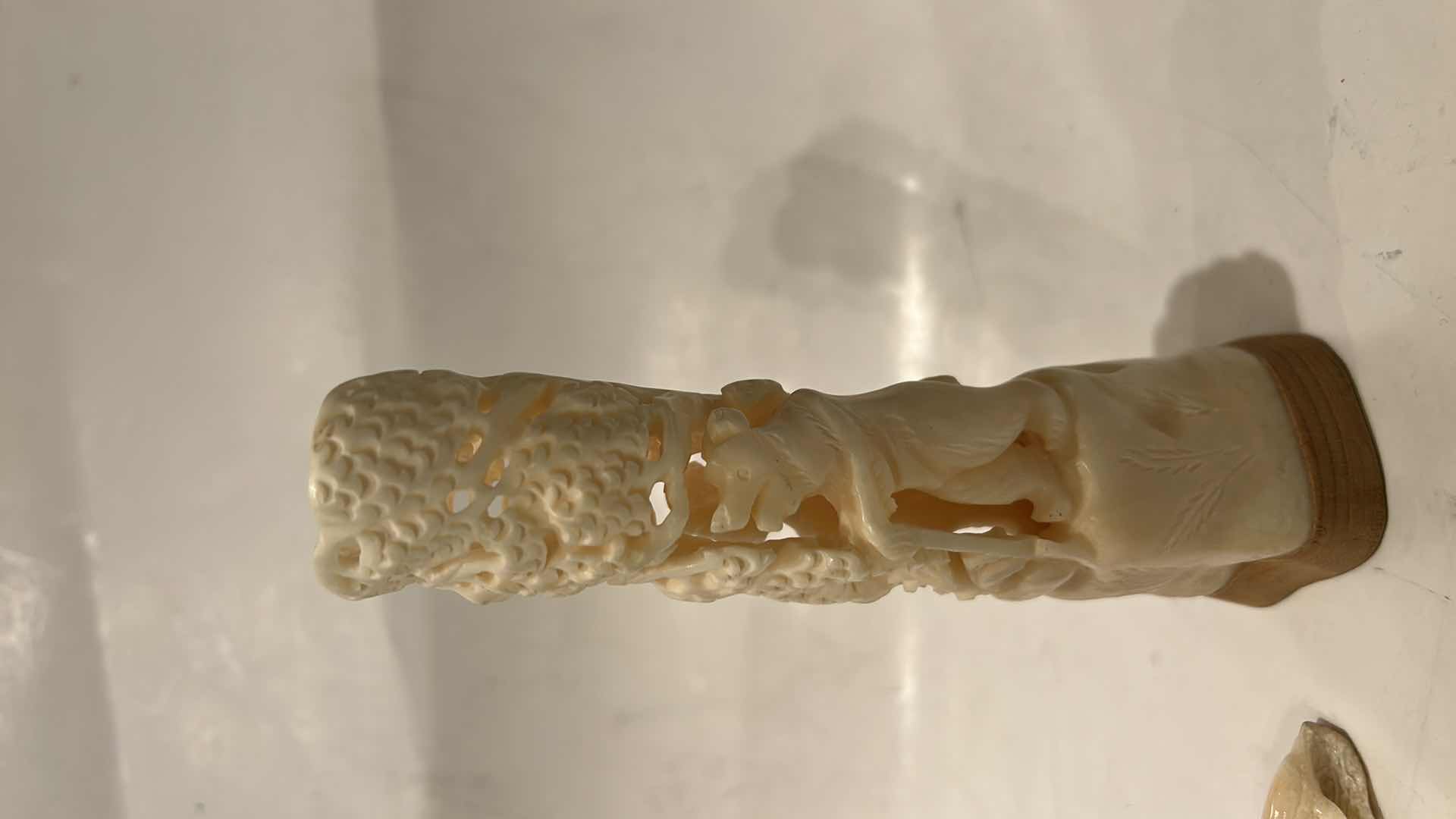 Photo 1 of 2 - IVORY OR BONE INTRICATELY HAND-CARVED AND PIERCED, DEPICTING FIGURES (POSSIBLY DEITIES OR MYTHICAL BEASTS) DOLPHINS AND NATURAL THEMES.
(TALLEST 5 1/2”)