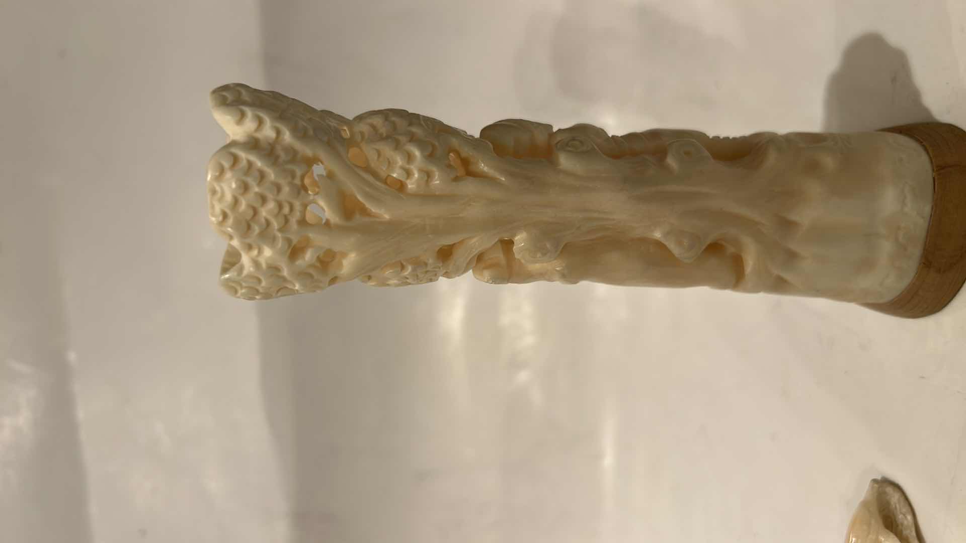 Photo 1 of 2 - IVORY OR BONE INTRICATELY HAND-CARVED AND PIERCED, DEPICTING FIGURES (POSSIBLY DEITIES OR MYTHICAL BEASTS) DOLPHINS AND NATURAL THEMES.
(TALLEST 5 1/2”)