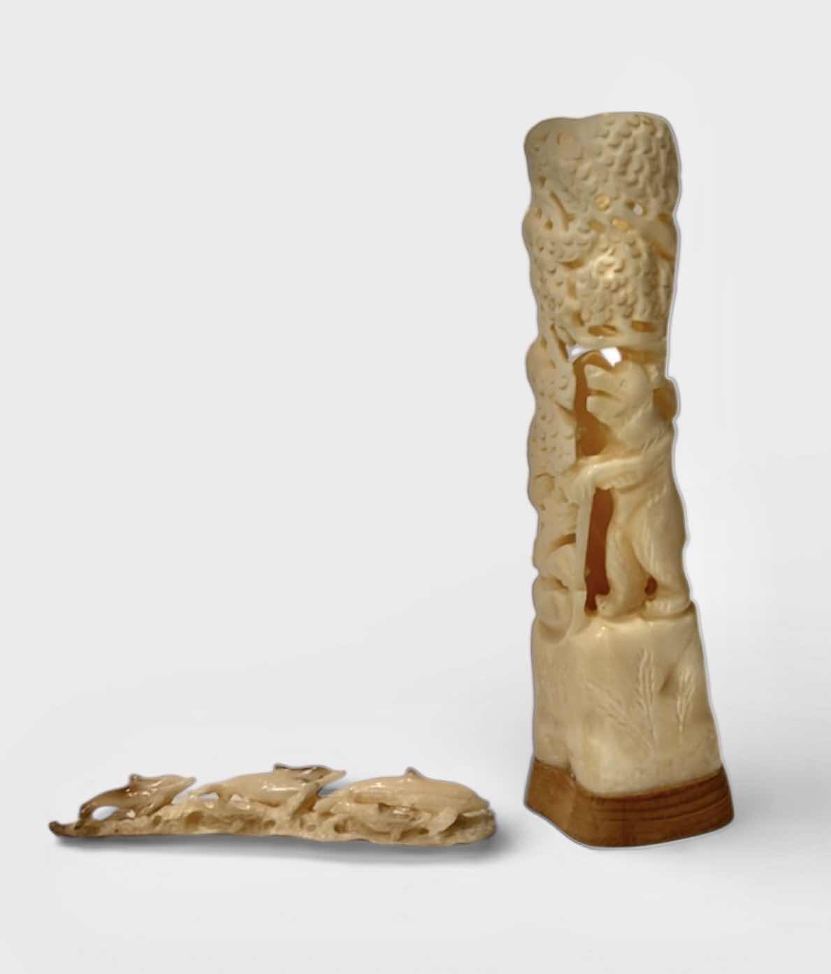 Photo 1 of 2 - IVORY OR BONE INTRICATELY HAND-CARVED AND PIERCED, DEPICTING FIGURES (POSSIBLY DEITIES OR MYTHICAL BEASTS) DOLPHINS AND NATURAL THEMES.
(TALLEST 5 1/2”)