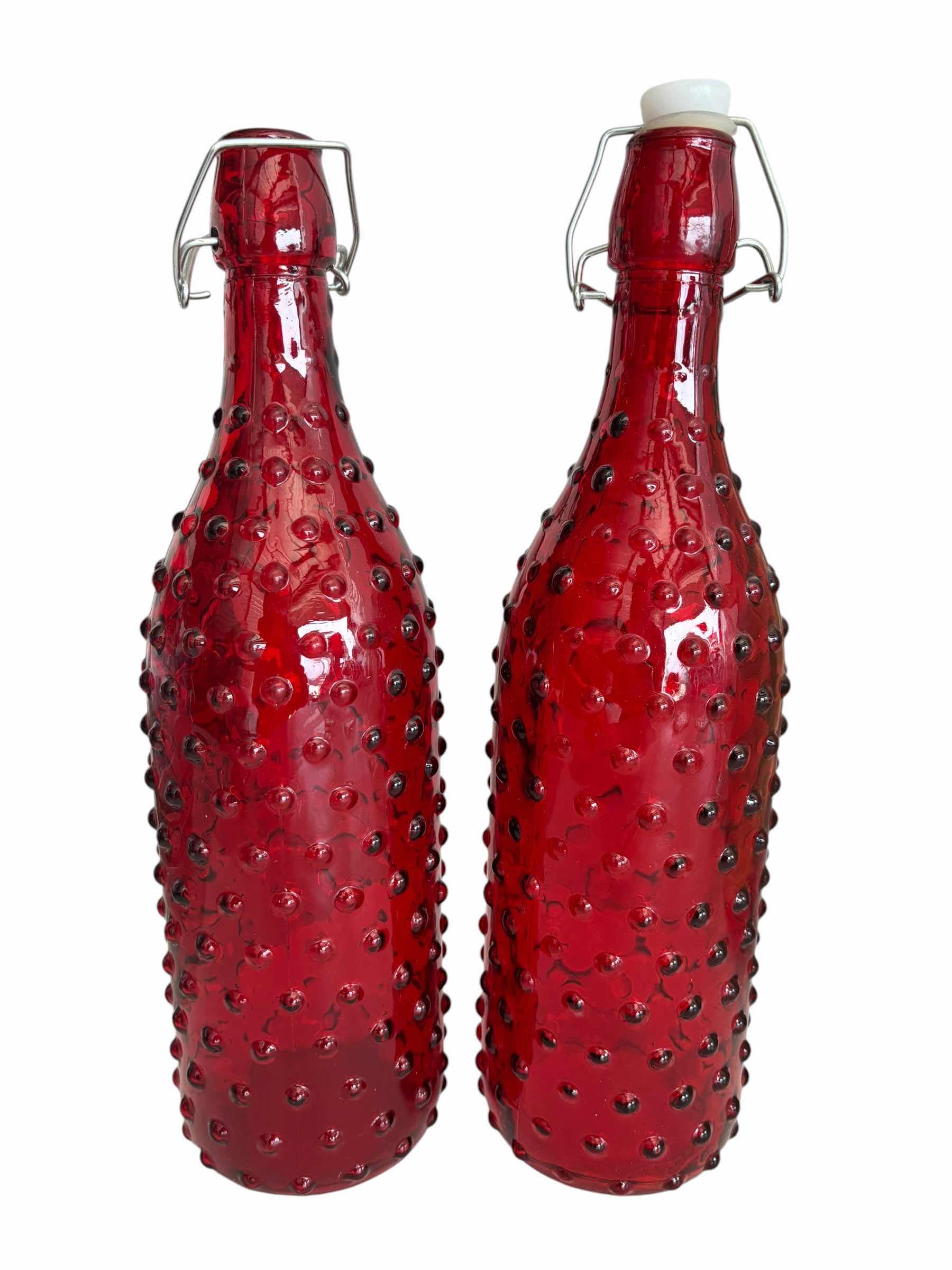 Photo 1 of WOODEN SERVING PADDLE, RED HOBNAIL GLASS BOTTLES & DECORATIVE GLASS BOTTLES (4)