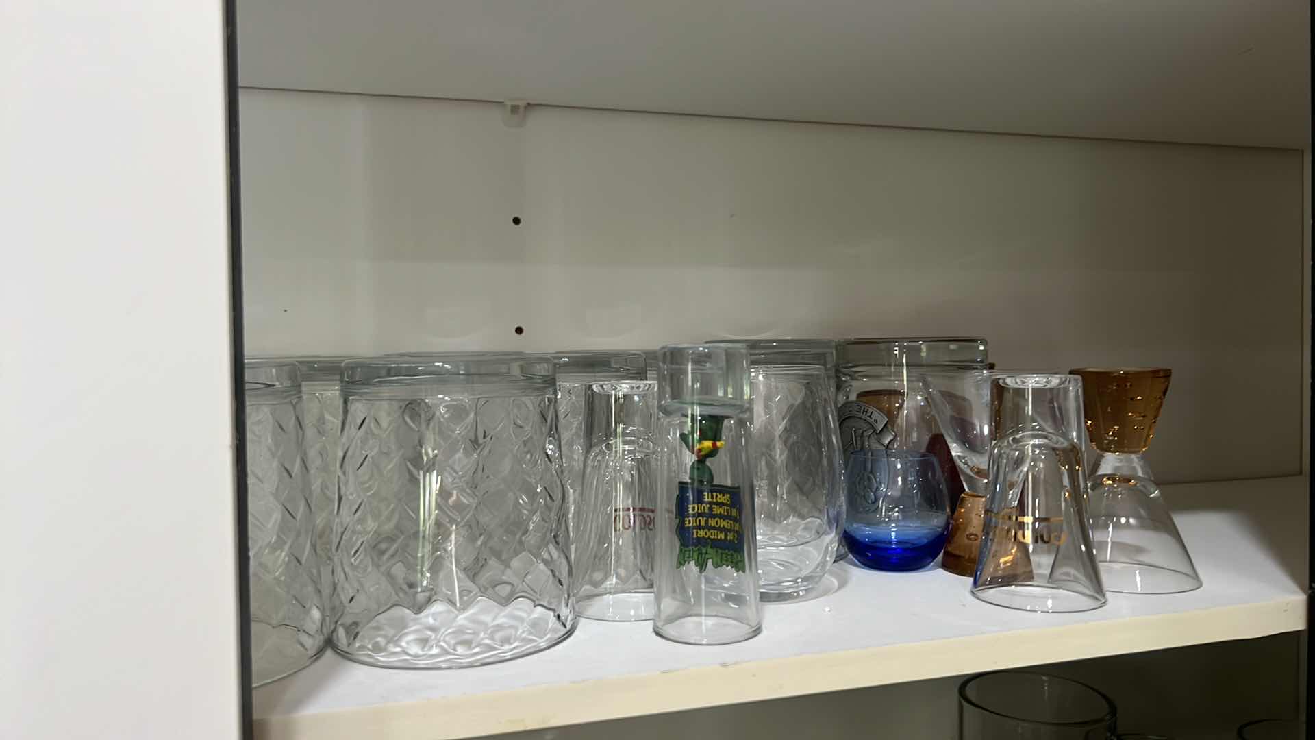 Photo 1 of CONTENTS OF KITCHEN CABINET-GLASSWARE