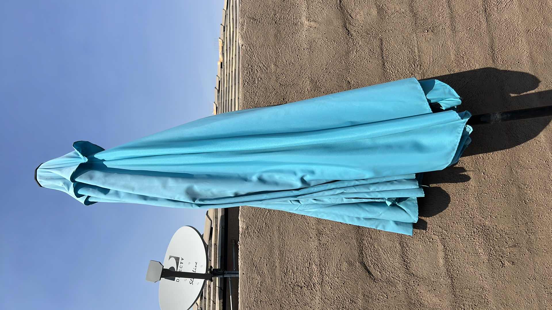 Photo 1 of BLUE UMBRELLA W ROLLING METAL HOLDER (HEAVY)