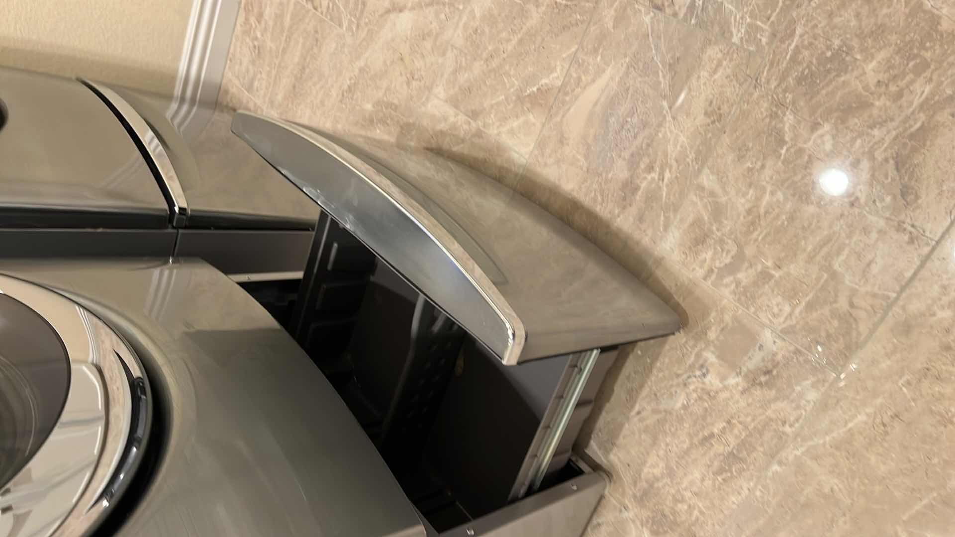 Photo 1 of CHROME WHIRLPOOL DUET HE FRONT LOAD & GO SYSTEM WASHER W PEDESTAL STORAGE