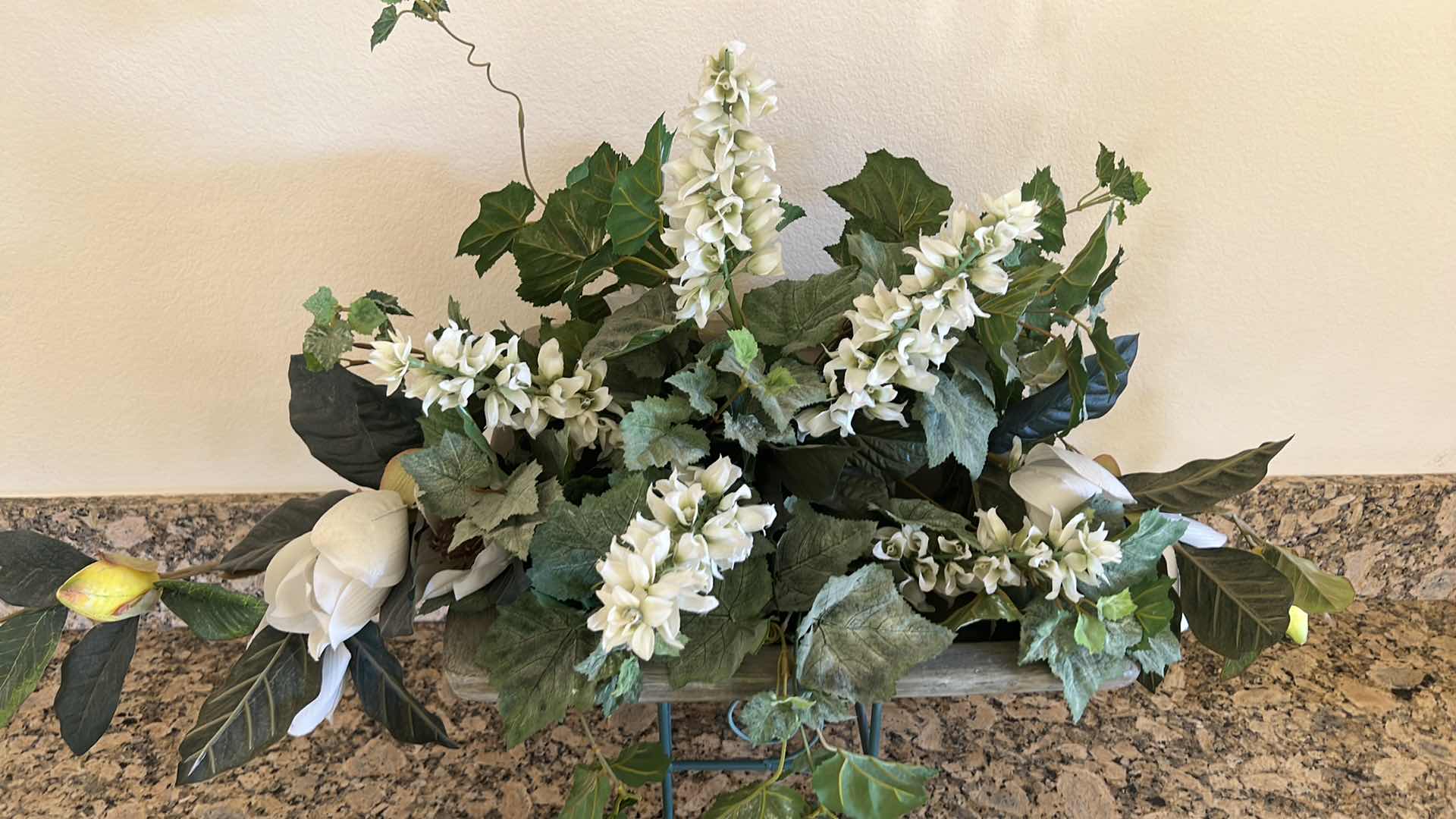 Photo 1 of FAUX FLORAL PLANT ARRANGEMENT IN HEAVY CERAMIC VASE ON GREEN METAL STAND 38" x 17" H27"