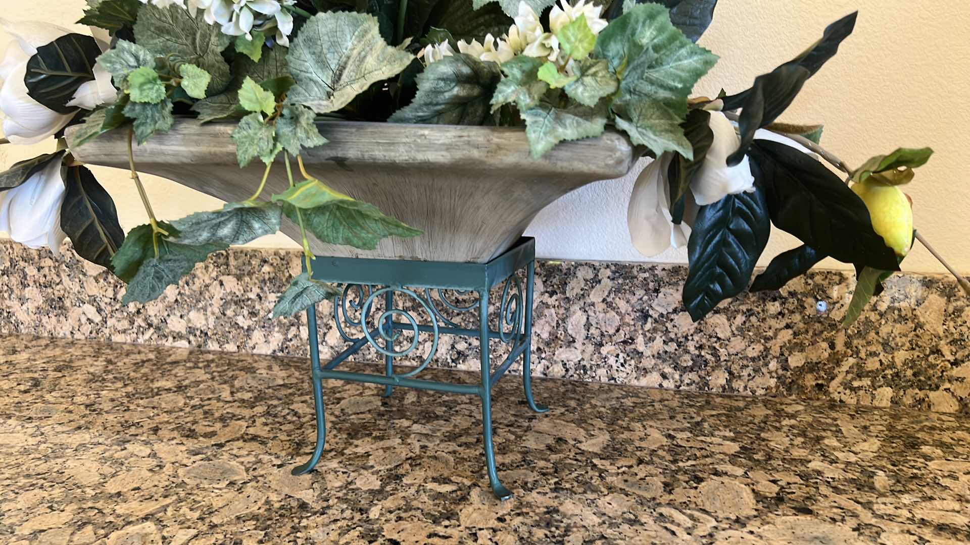 Photo 1 of FAUX FLORAL PLANT ARRANGEMENT IN HEAVY CERAMIC VASE ON GREEN METAL STAND 38" x 17" H27"