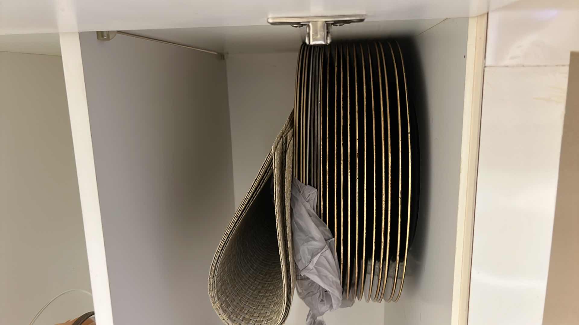 Photo 1 of CONTENTS OF KITCHEN CABINET- CAKE STAND, CHARGERS, PLACEMATS