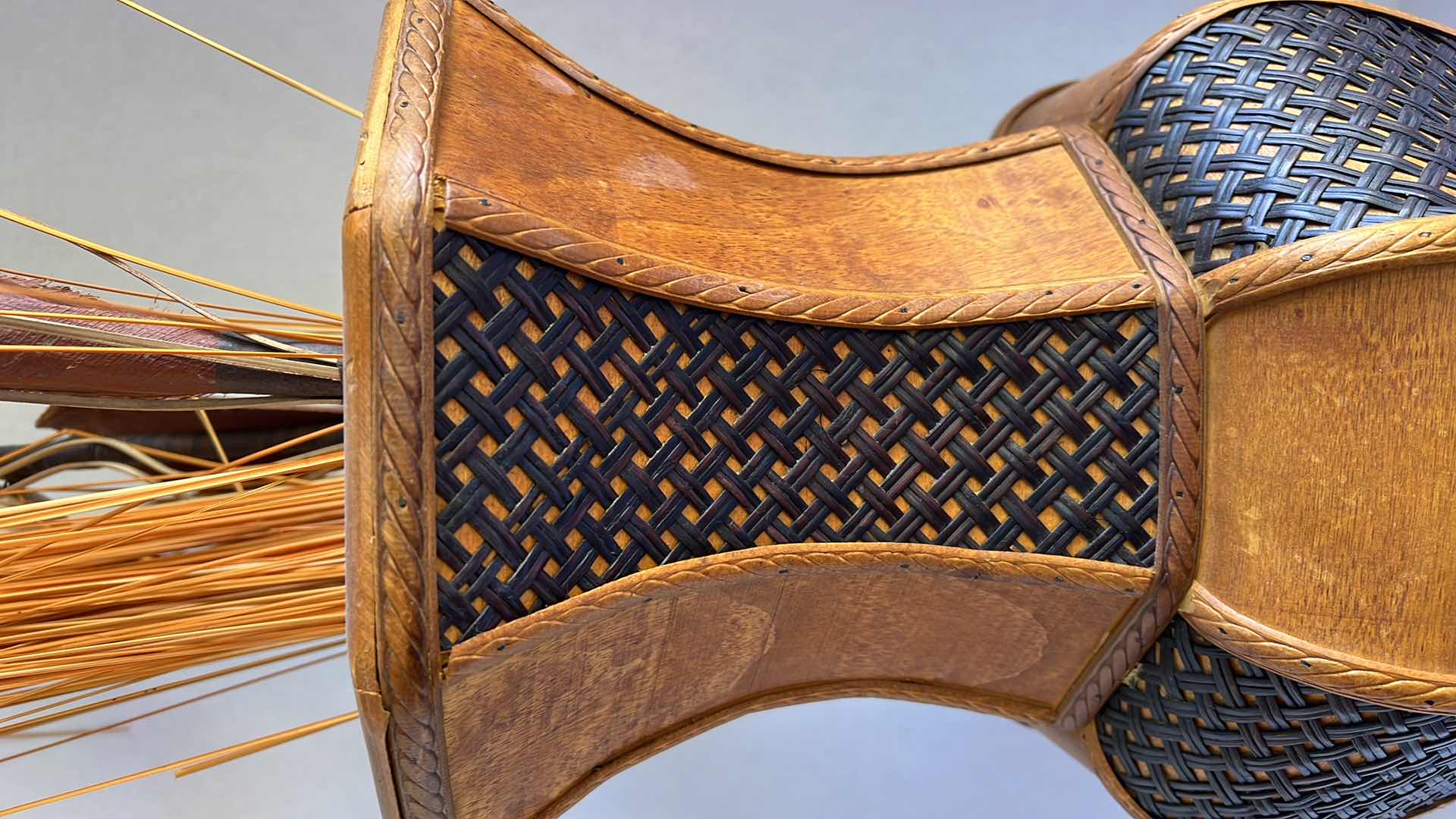 Photo 1 of DECORATIVE ORANGE-BROWN WOODEN VASE. WITH FAUX REEDS AND PLANTS. 10” WICKER AND WOOD DETAILING. 1 OF 2 IN SET. SOLD SEPARATELY