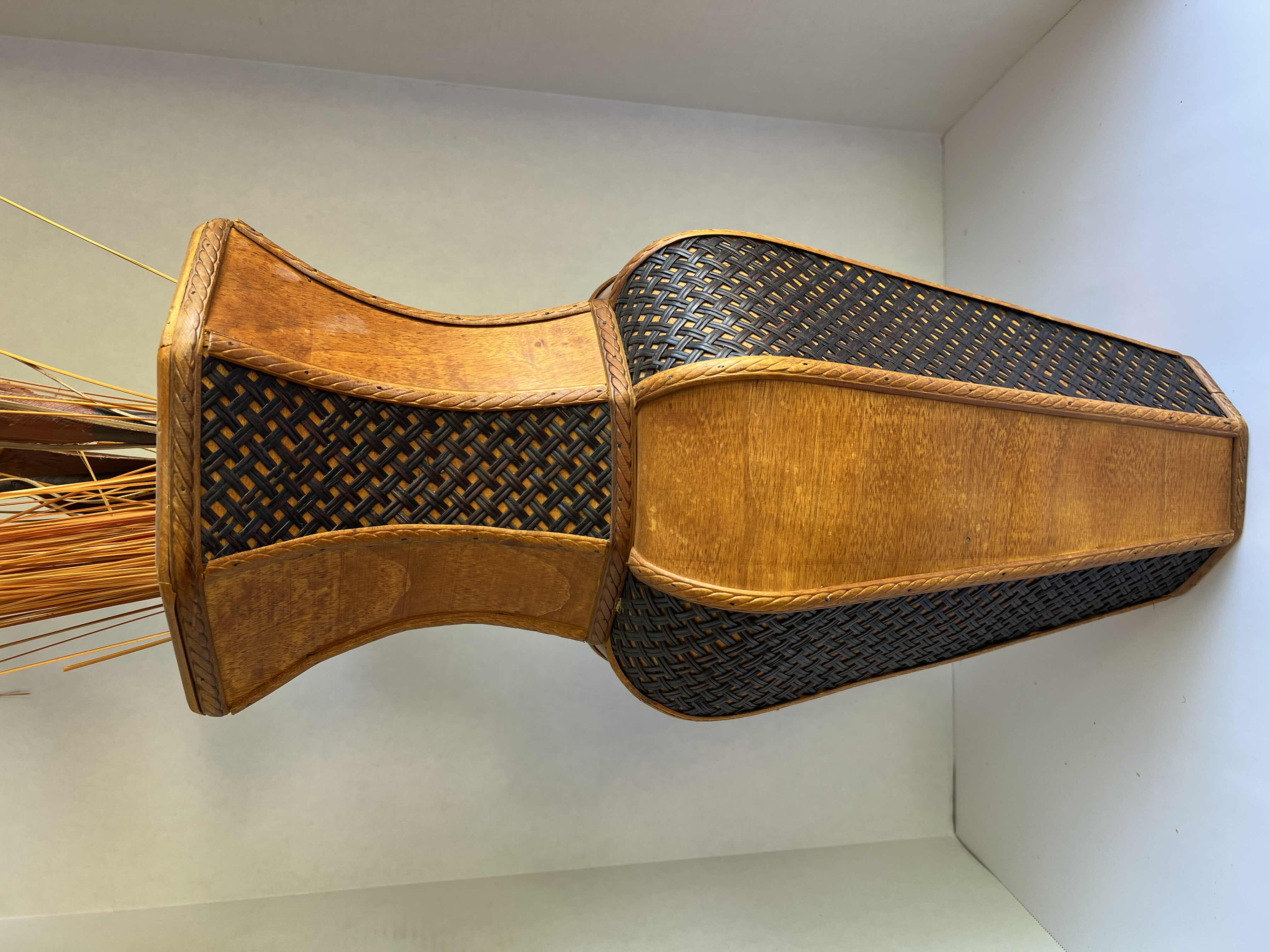 Photo 1 of DECORATIVE ORANGE-BROWN WOODEN VASE. WITH FAUX REEDS AND PLANTS. 10” WICKER AND WOOD DETAILING. 1 OF 2 IN SET. SOLD SEPARATELY