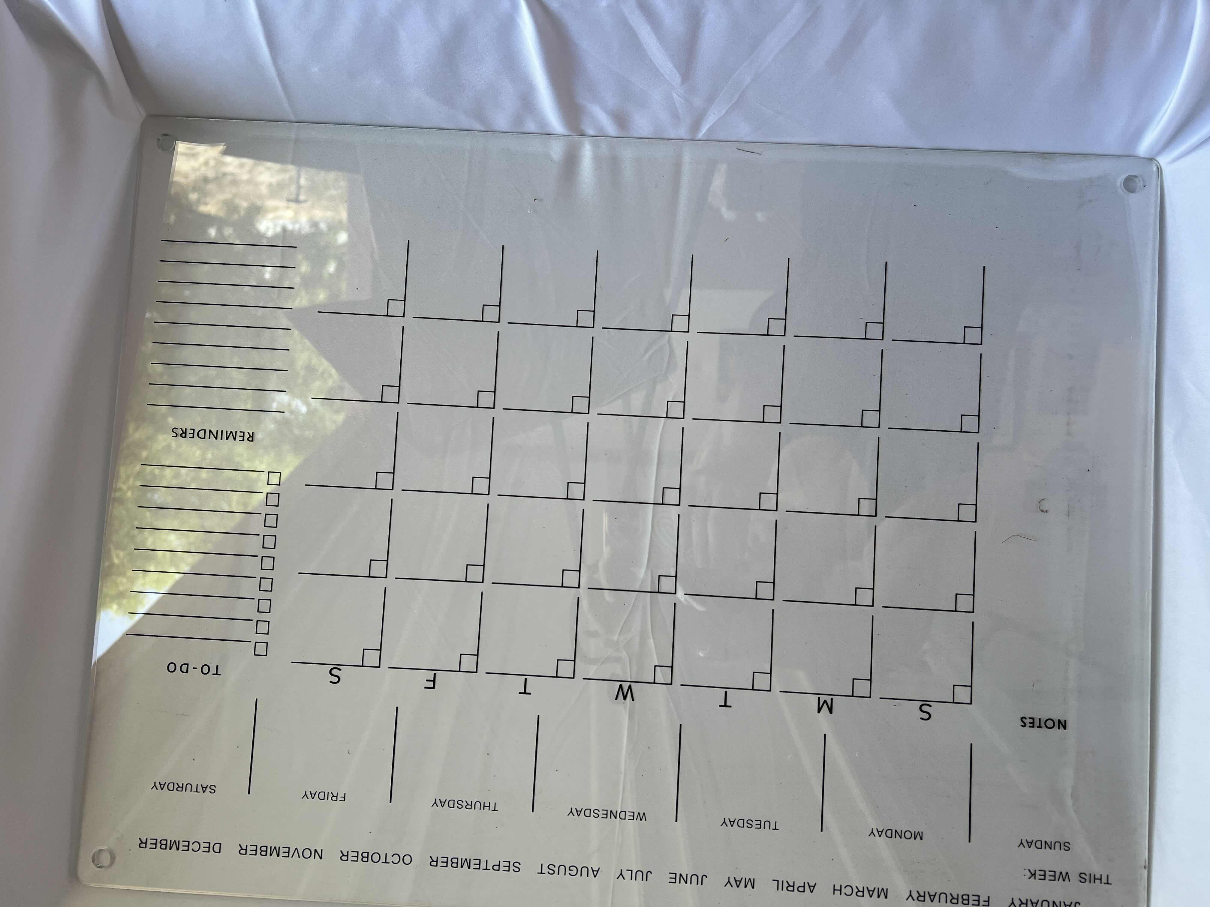 Photo 1 of BRANDNEW CLEAR LACQUER HANGING DRY ERASE CALENDAR 24” x 18” 