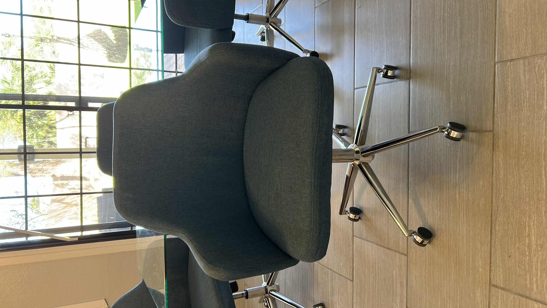 Photo 3 of GLASS TOP DINING TABLE W SILVER CHROME LEGGS  4- SWIVEL BLUE FABRIC CHAIRS CHROME LEGGS ON WHEELS