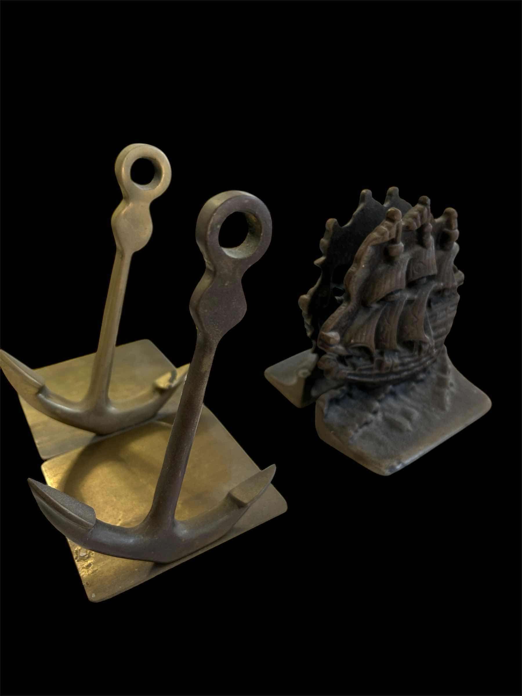 Photo 1 of CAST IRON SAILING SHIP BOOKENDS AND VINTAGE BRASS ANCHOR BOOKENDS