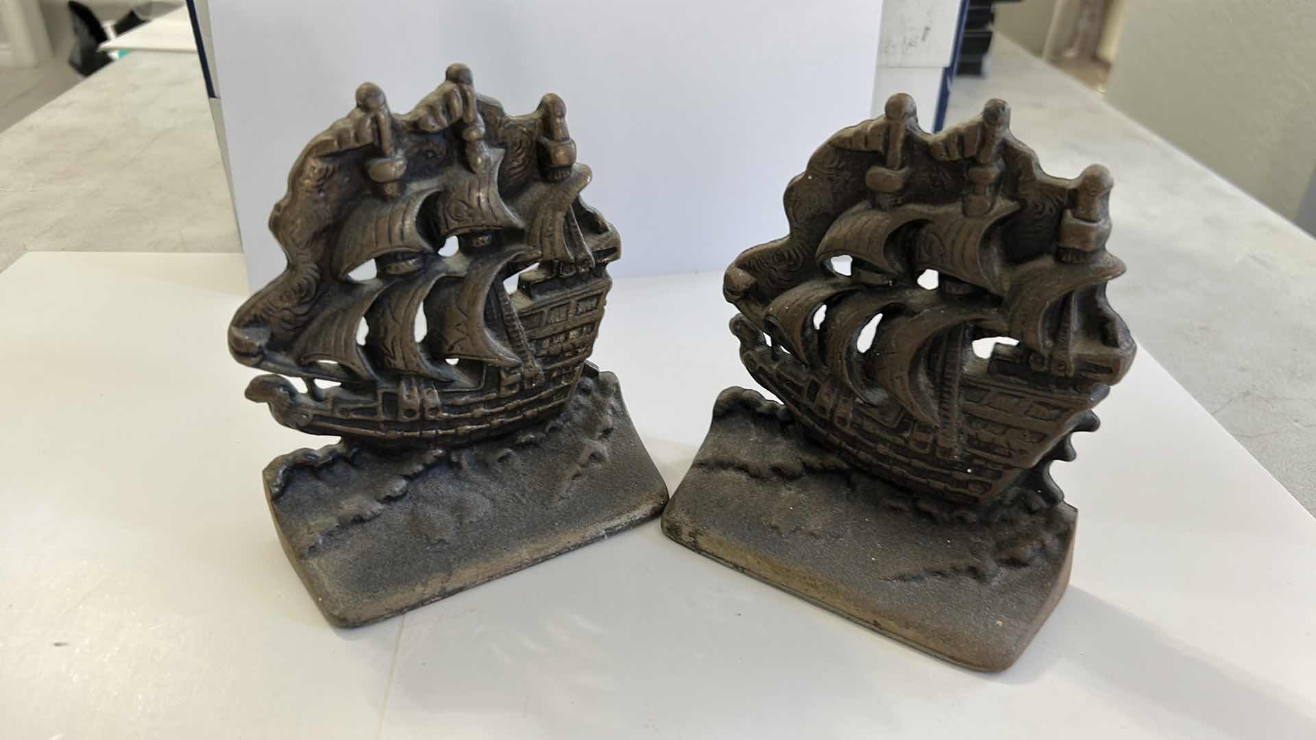Photo 1 of CAST IRON SAILING SHIP BOOKENDS AND VINTAGE BRASS ANCHOR BOOKENDS