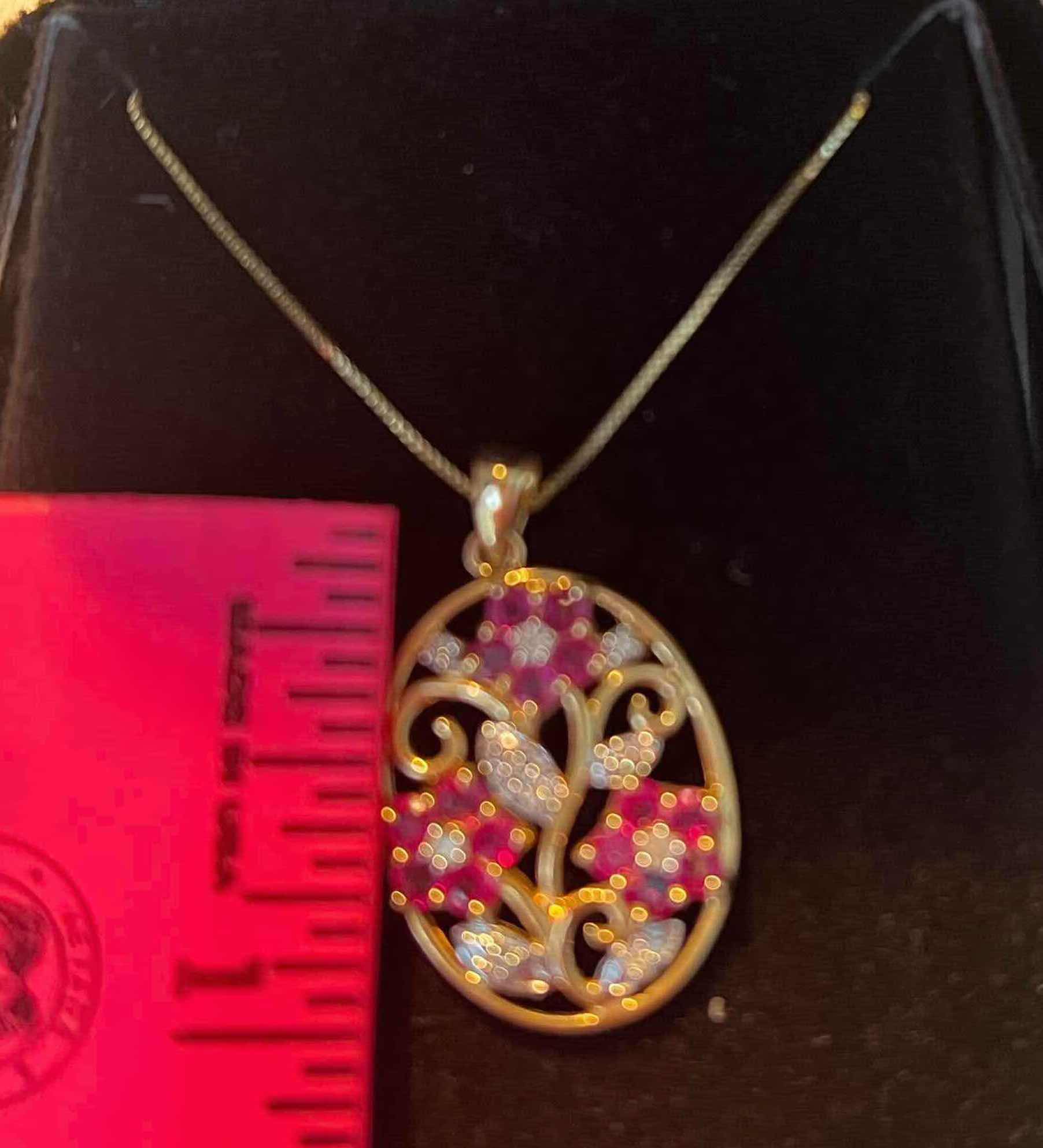 Photo 1 of FINE JEWLERY-RUBY AND DIAMOND FLOWER PENDANT NECKLACE.