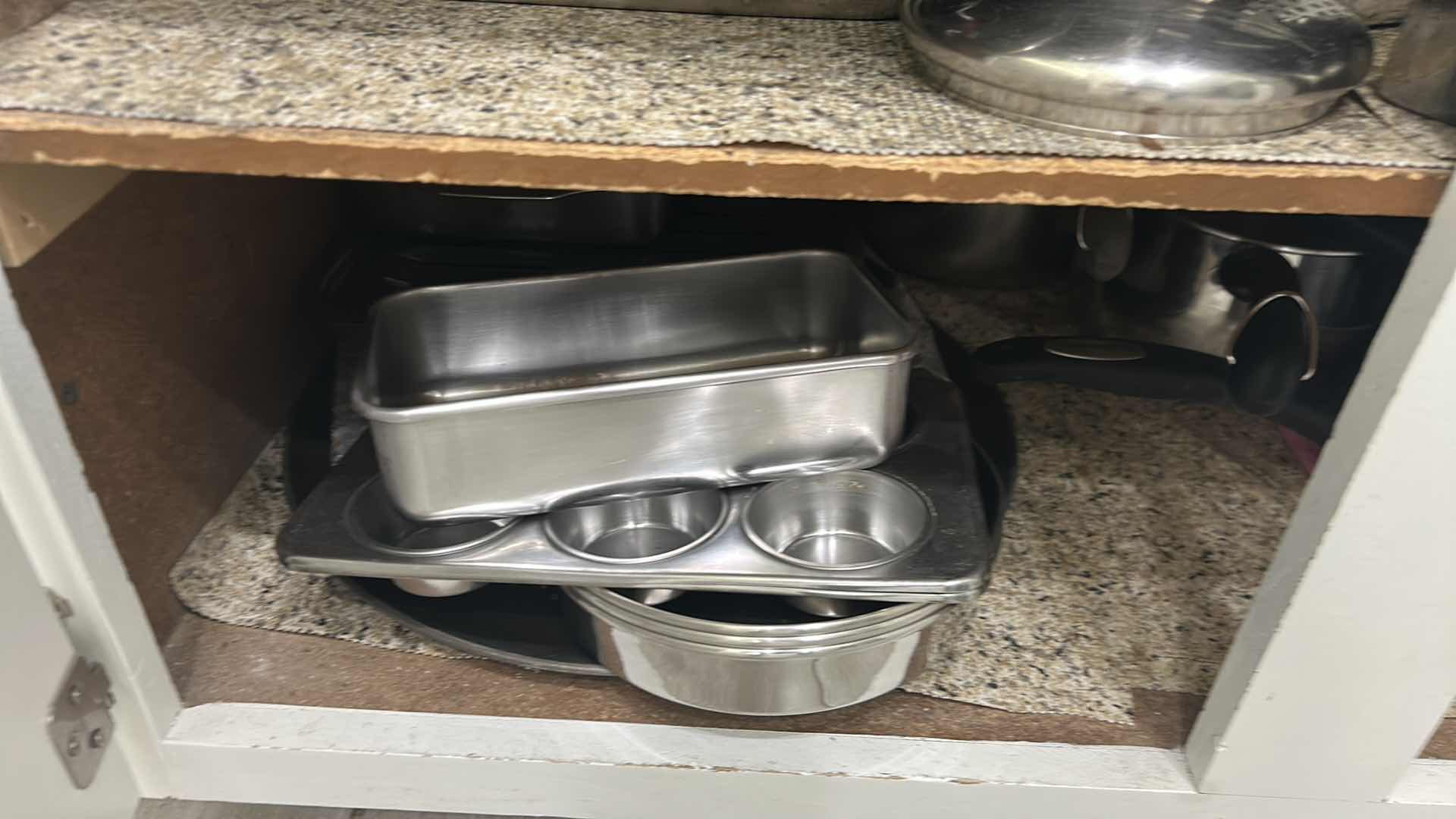 Photo 1 of CONTENTS OF CABINET POTS PANS