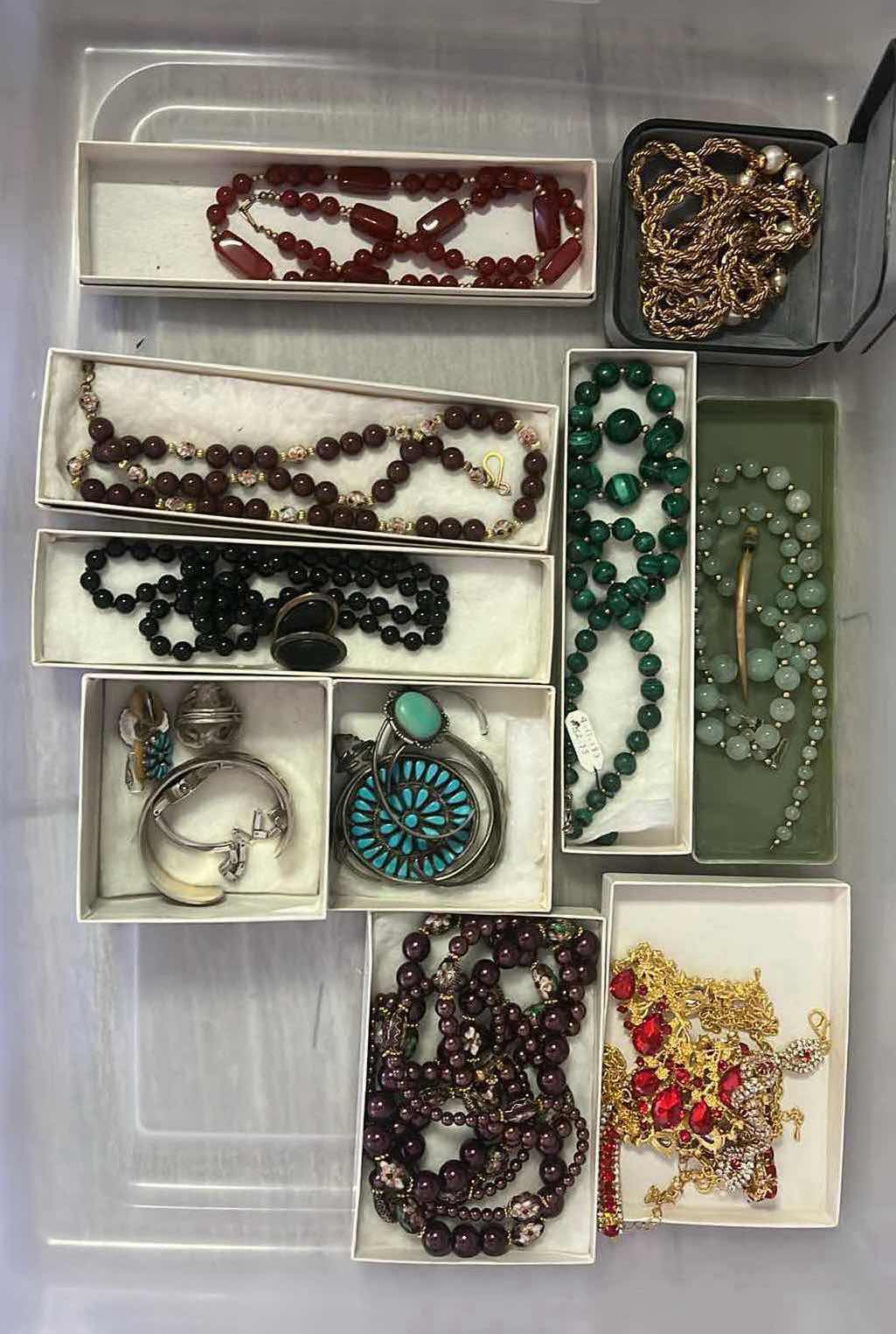 Photo 1 of CONTENTS OF BOX- VARIOUS FASHION JEWELRY. NECKLACES, BRACELETS, RINGS.