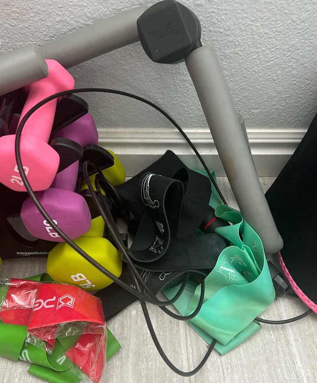 Photo 1 of EXERCISE EQUIPTMENT-COLORFUL SET OF DUMBELLS-RESISTANCE BANDS ETC…THIGH PRESS.