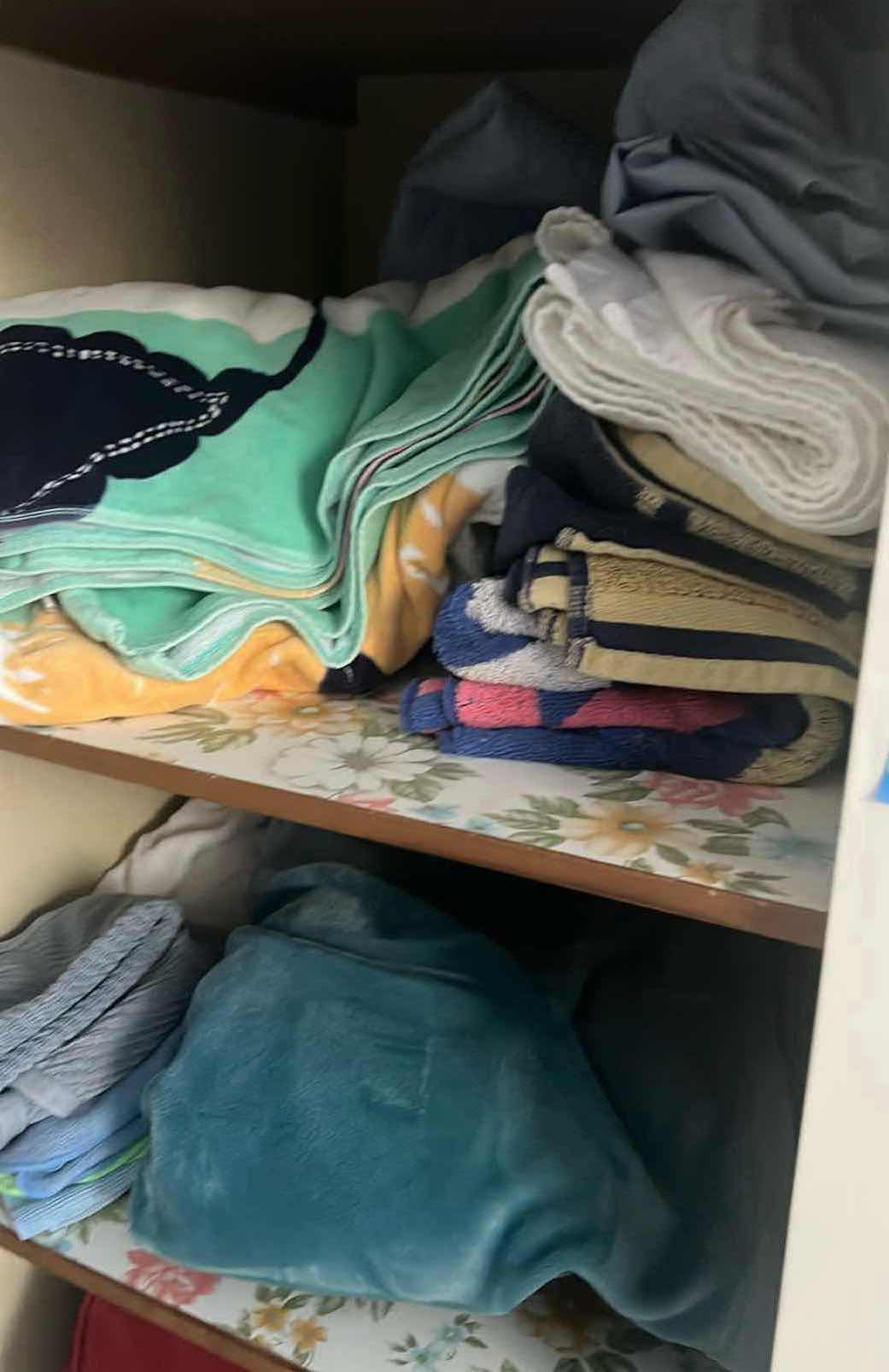 Photo 1 of CONTENTS OF LINEN CABINET. TOWELS AND BLANKETS.