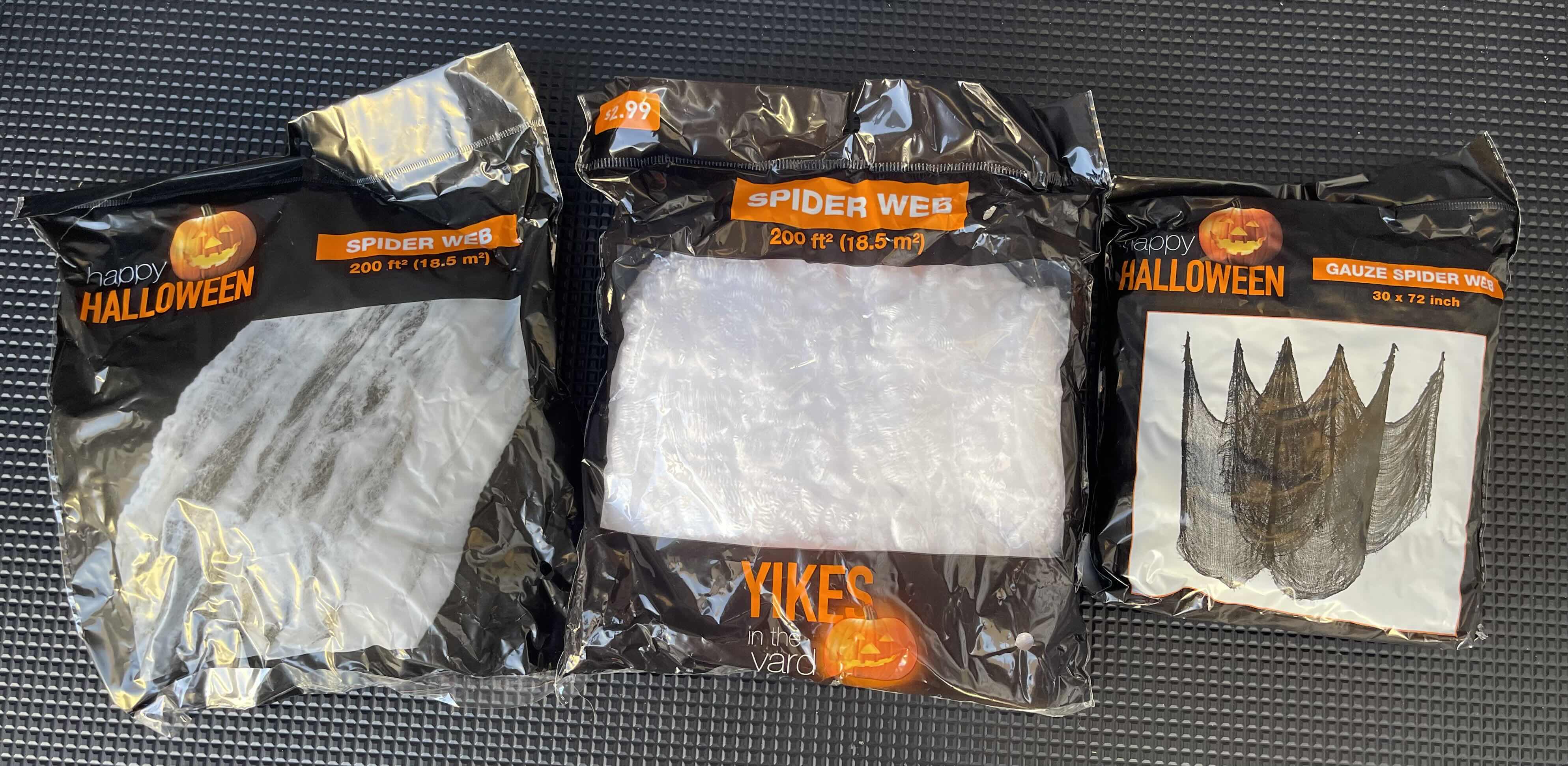 Photo 1 of BOX OF HAPPY HALLOWEEN SPIDER WEBS - SPIDER WEB BAGS (34), SPIDER WEB YIKES IN THE YARD (9) & GAUZE SPIDER WEB BAGS (3)