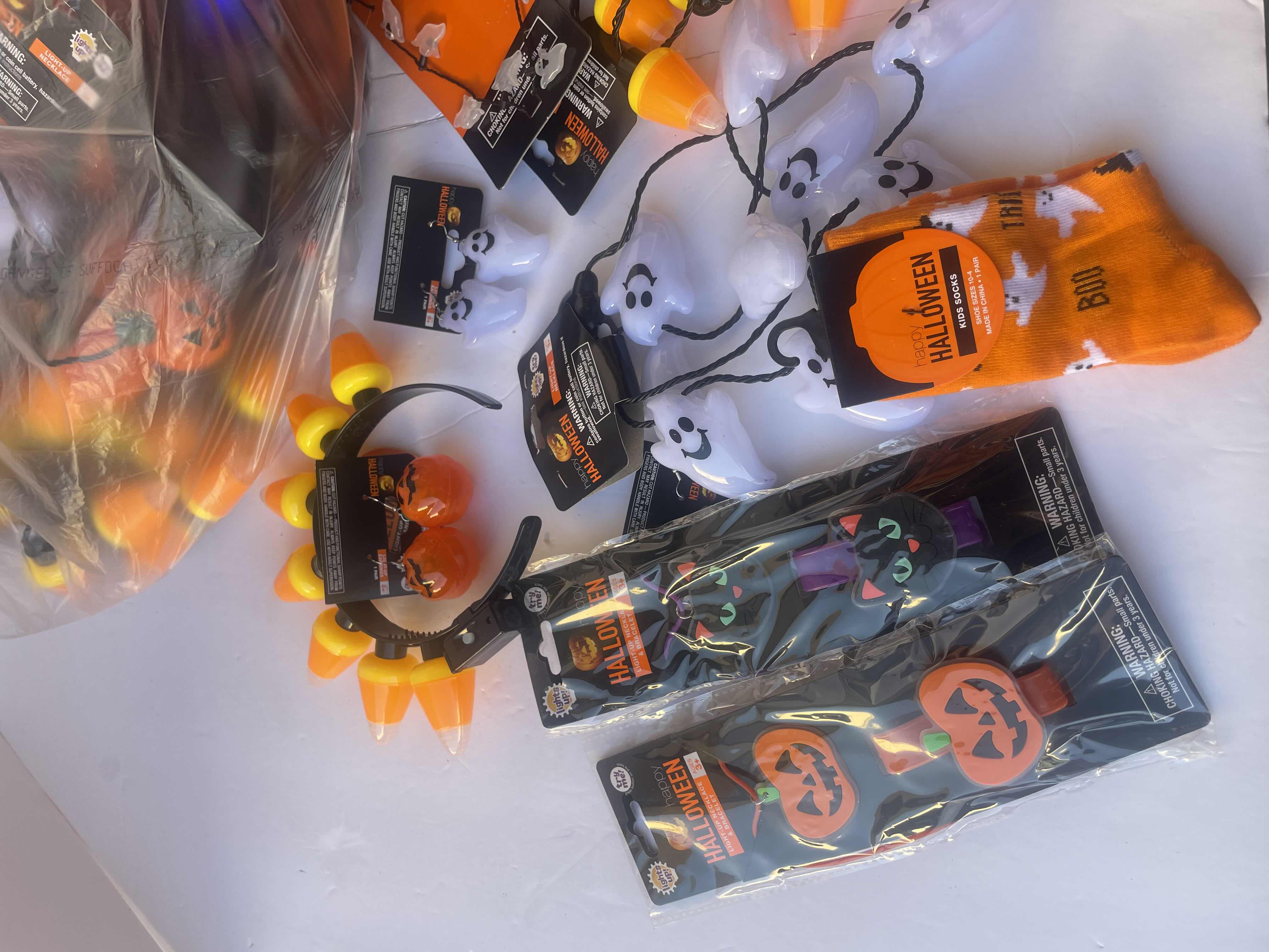 Photo 1 of NEW HAPPY HALLOWEEN LIGHT-UP NECKLACES, HEAD BANDS, BRACELETS AND OTHER FUN HALLOWEEN WEAR (30 PIECES)
