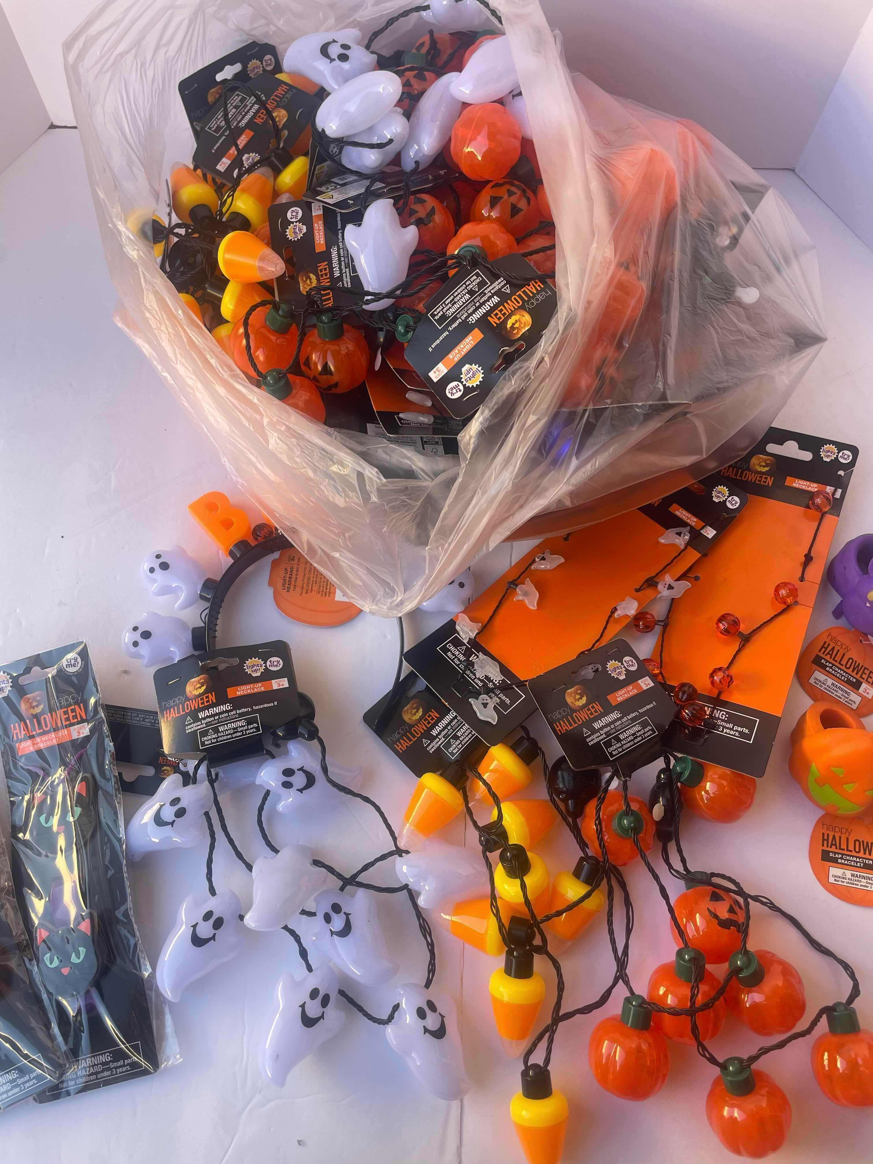 Photo 1 of NEW HAPPY HALLOWEEN LIGHT-UP NECKLACES. HEADBANDS, BRACELETS AND OTHER FUN HALLOWEEN WEAR (30 PIECES)
