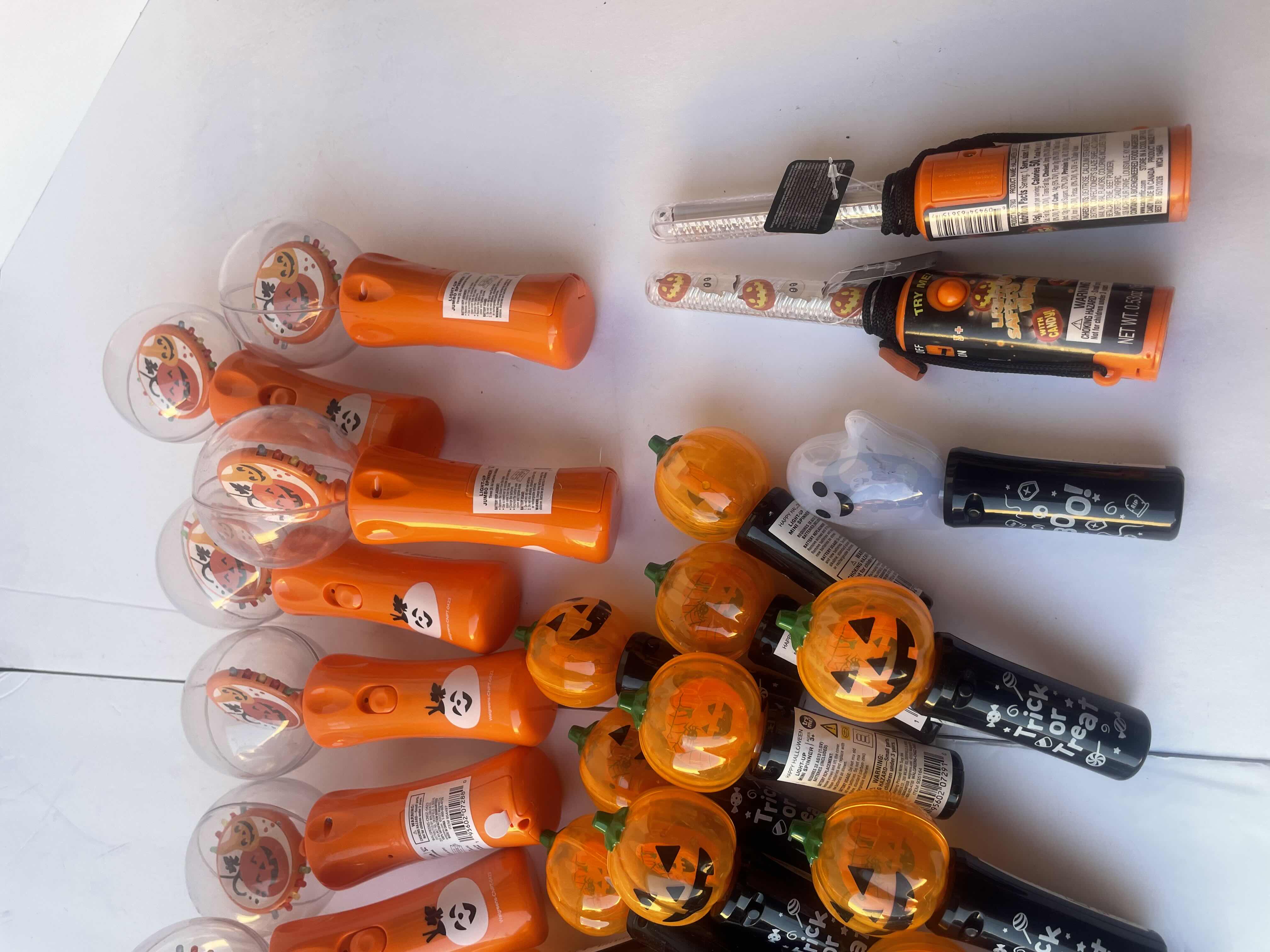 Photo 1 of HAPPY HALLOWEEN LIGHT UP SPINNERS/WANDS LOT (30 PIECES)