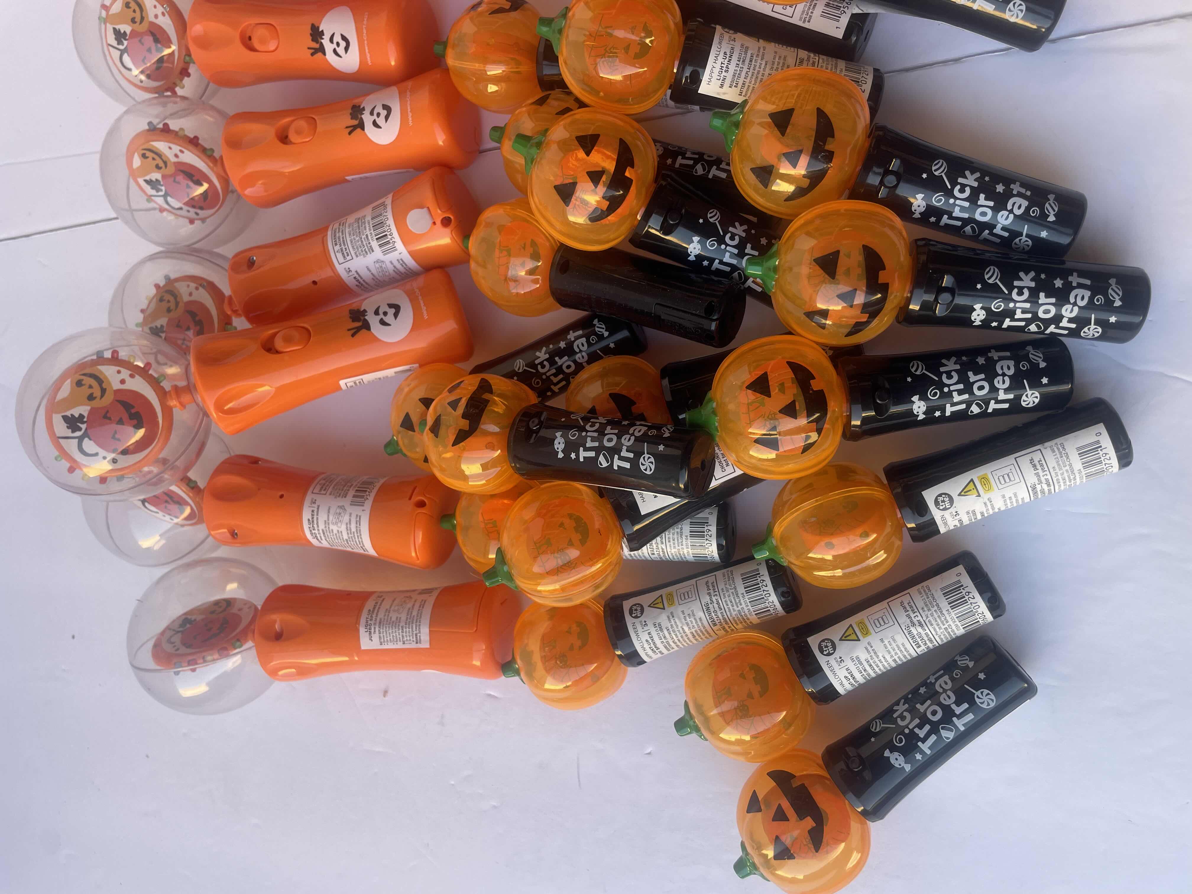 Photo 1 of HAPPY HALLOWEEN LIGHT UP SPINNERS/WANDS LOT (30 PIECES)