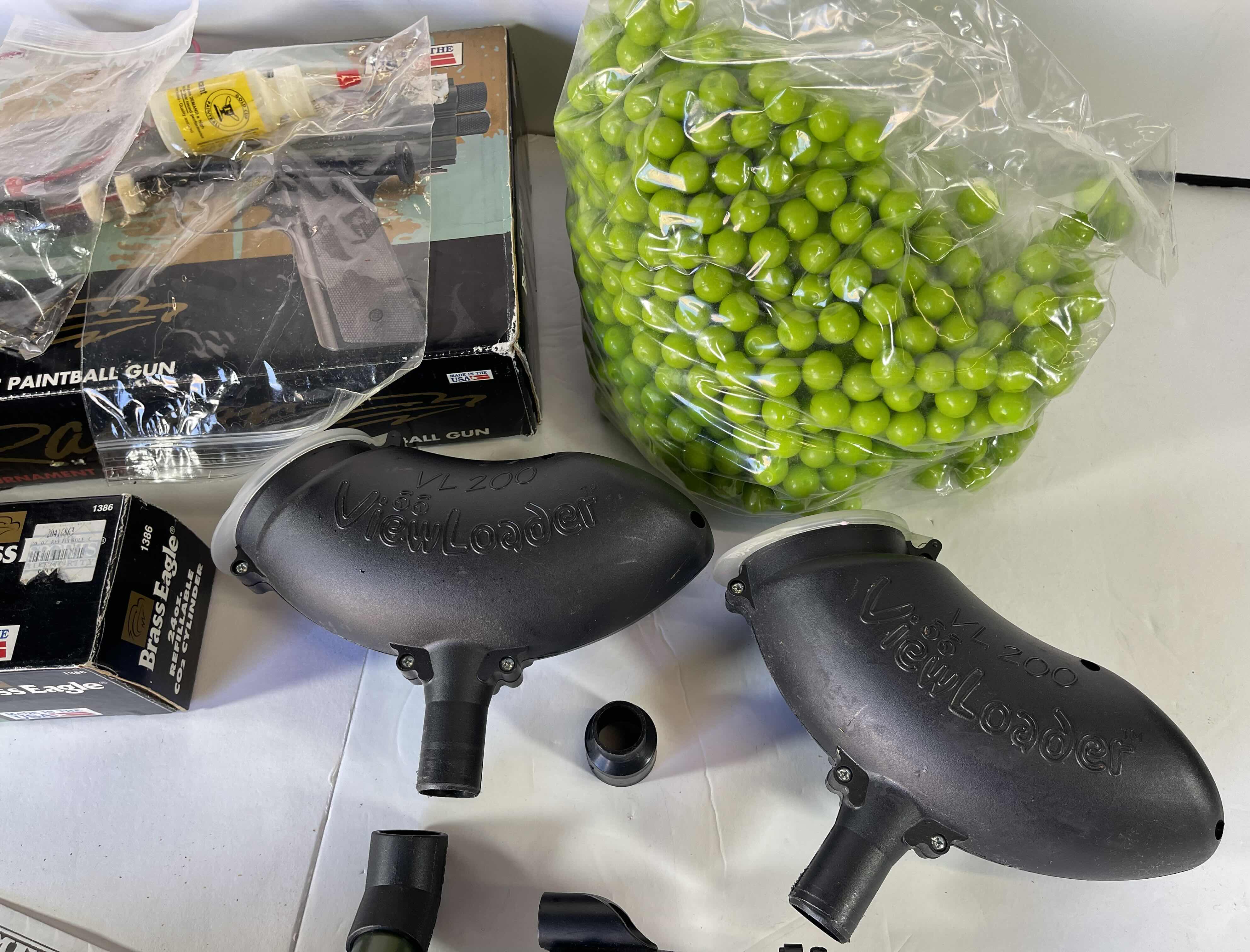 Photo 1 of RAPTOR TOURNAMENT GRADE SEMI-AUTOMATIC PAINTBALL GUN WITH REFILLABLE CYLINDER & 1000 GREEN PAINTBALLS