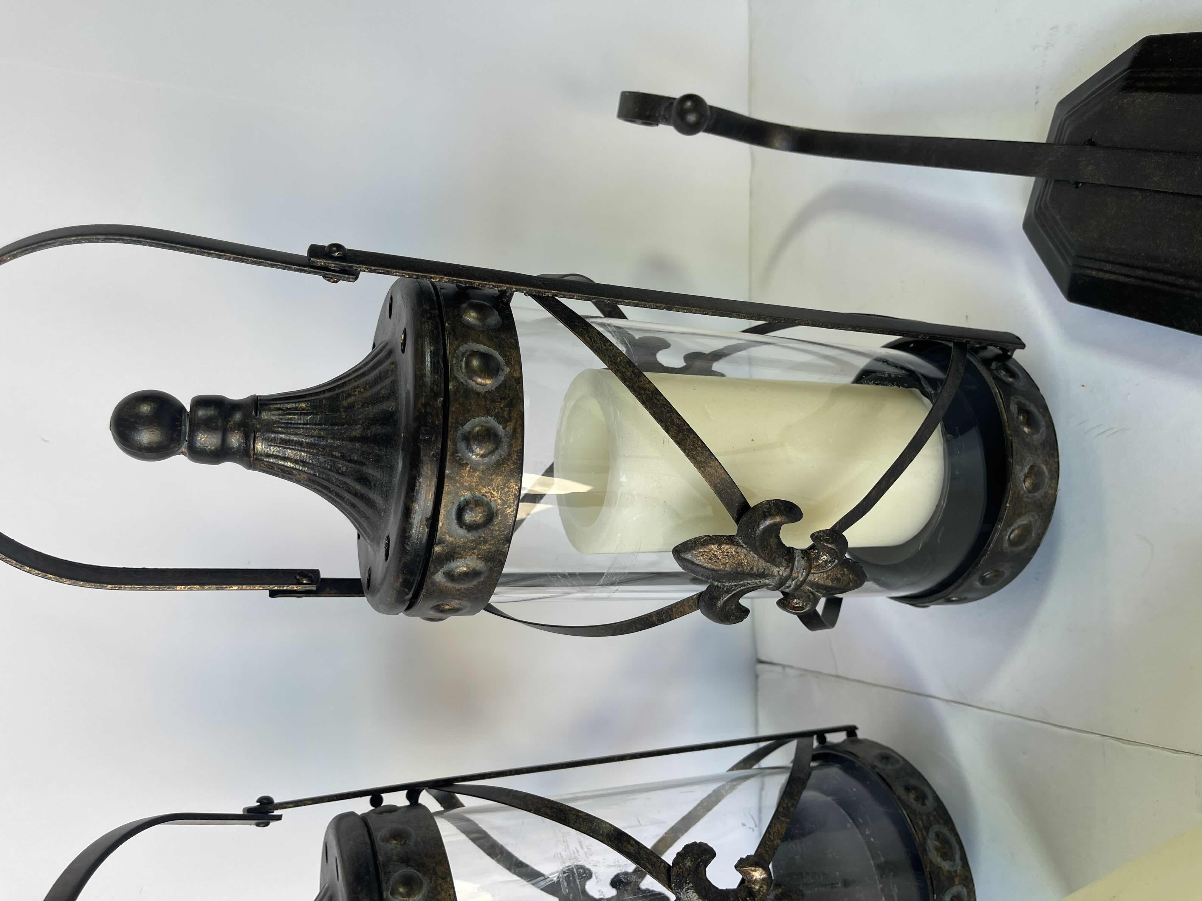 Photo 1 of PAIR OF HANGING CANDLE SCONCES GLASS CYLINDER BRASS FINISH WITH BATTERY CANDLES