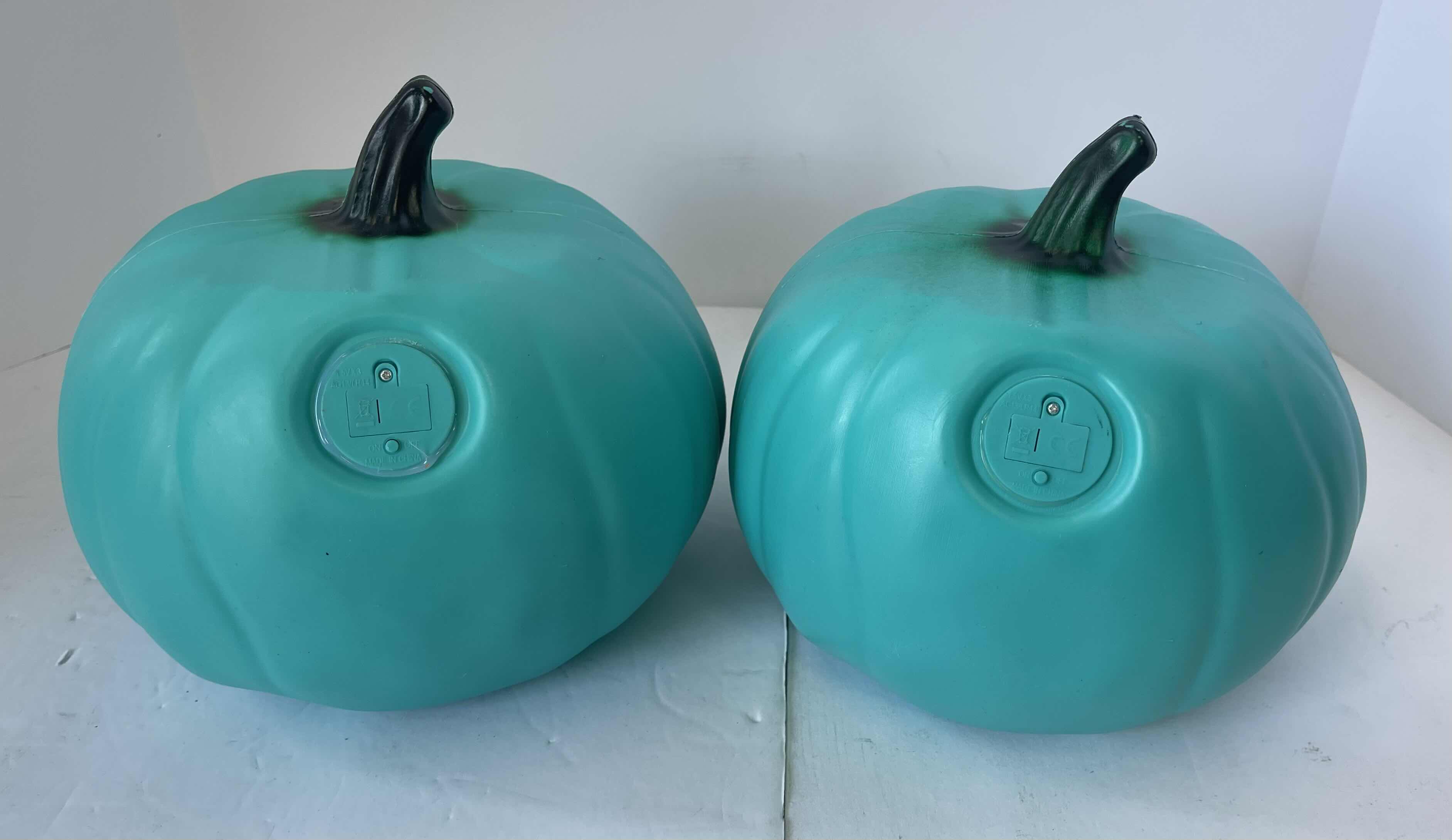 Photo 1 of GREEN PLASTIC LED LIGHT UP PUMPKINS (2) H7.5” NEW