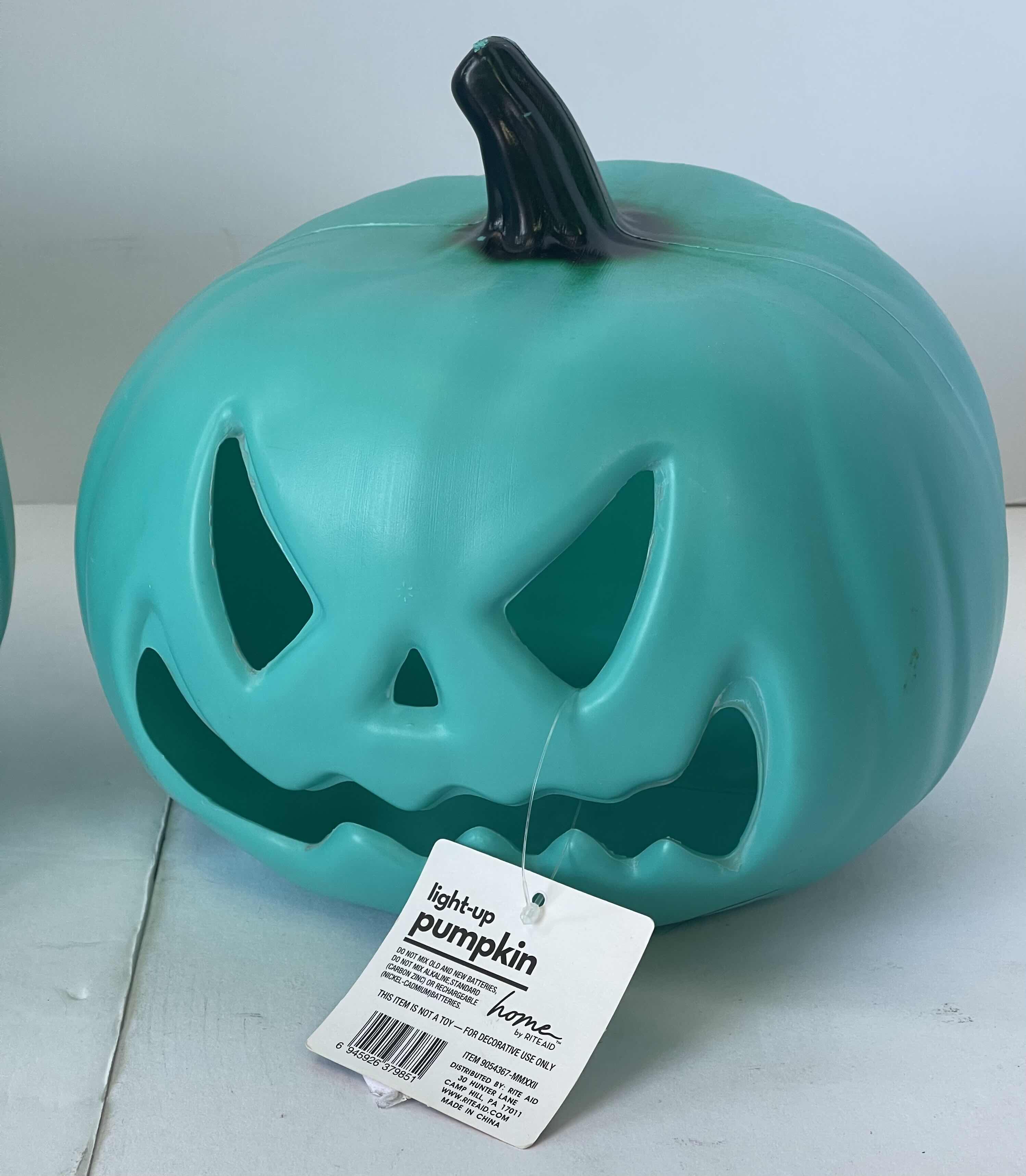 Photo 1 of GREEN PLASTIC LED LIGHT UP PUMPKINS (2) H7.5” NEW