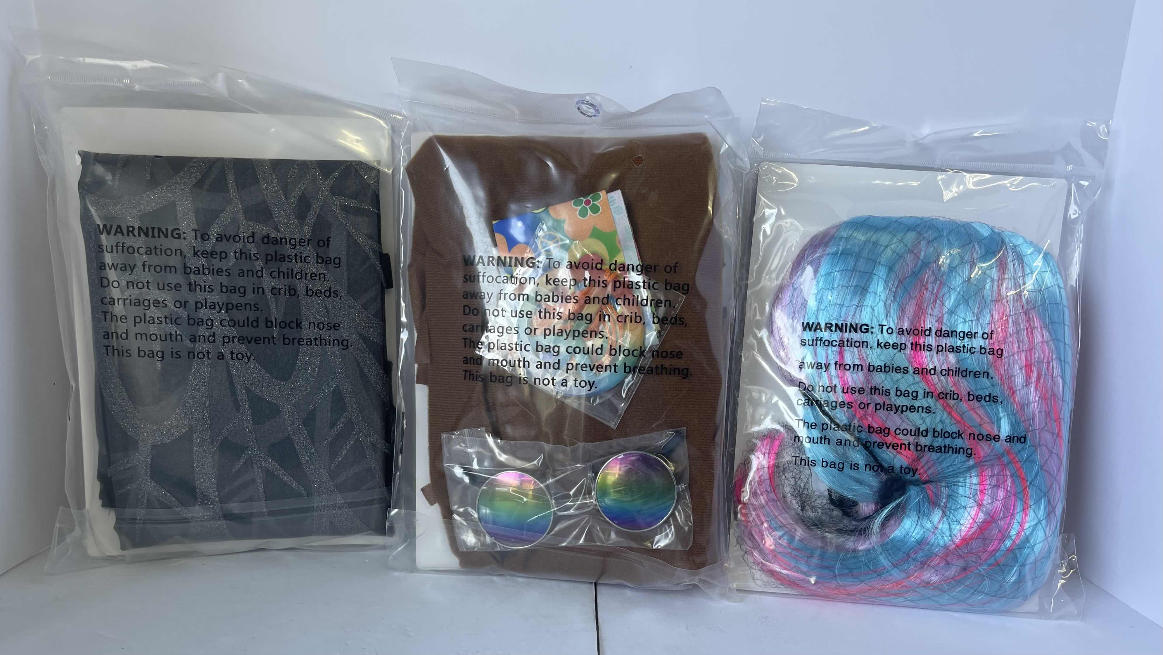 Photo 1 of HALLOWEEN ASSORTED COSTUMES - RAVEN WINGS, 60’S COSTUMES KIT & MULTI COLORED BOB WIG - ONE SIZE FITS MOST