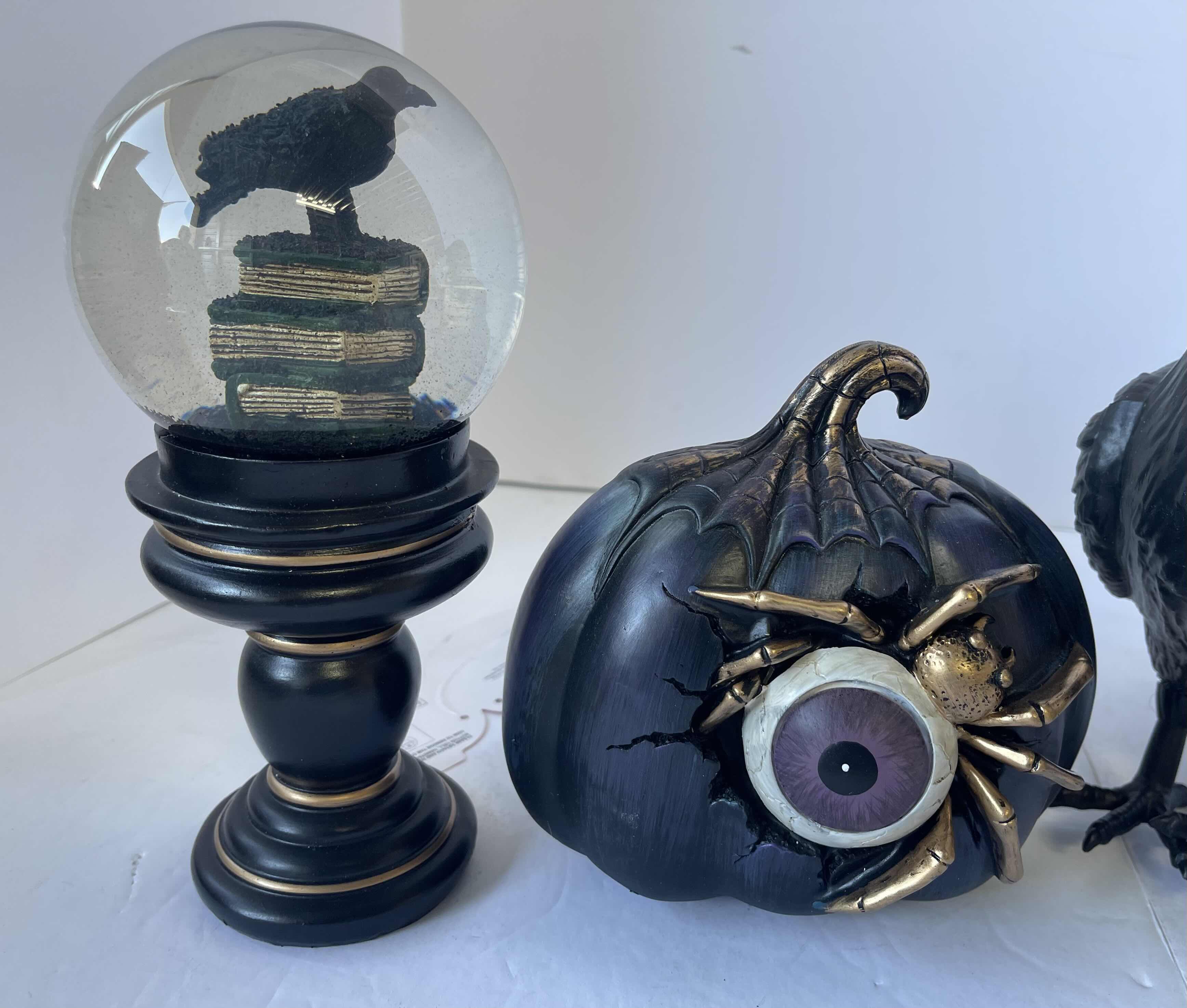 Photo 1 of HALLOWEEN TABLE
TOP DECOR - LIGHT UP SPIDER PUMPKIN, RAVEN WATER GLOBES (2) & PLASTIC RAVEN