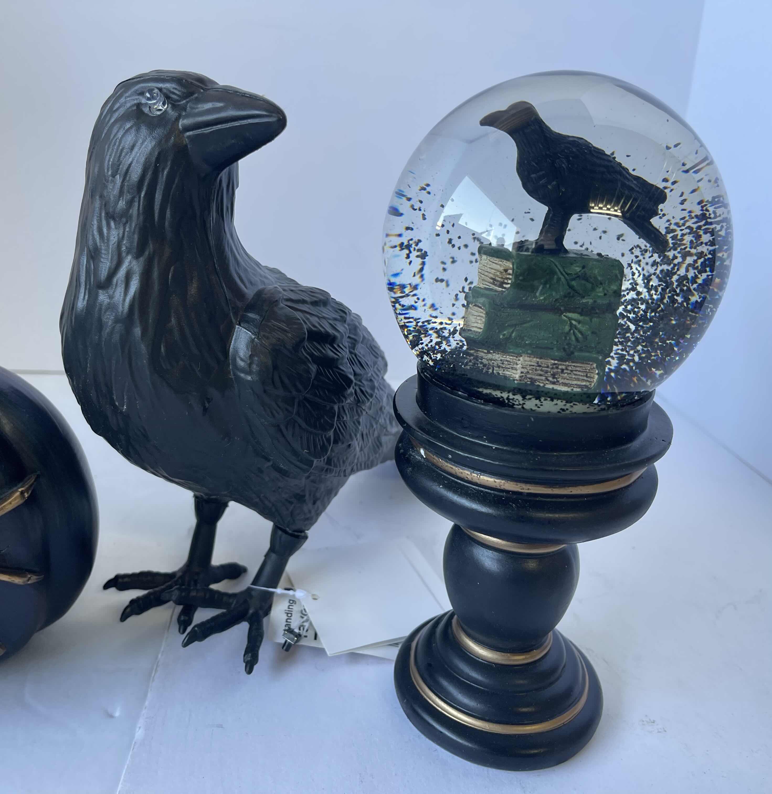 Photo 1 of HALLOWEEN TABLE
TOP DECOR - LIGHT UP SPIDER PUMPKIN, RAVEN WATER GLOBES (2) & PLASTIC RAVEN