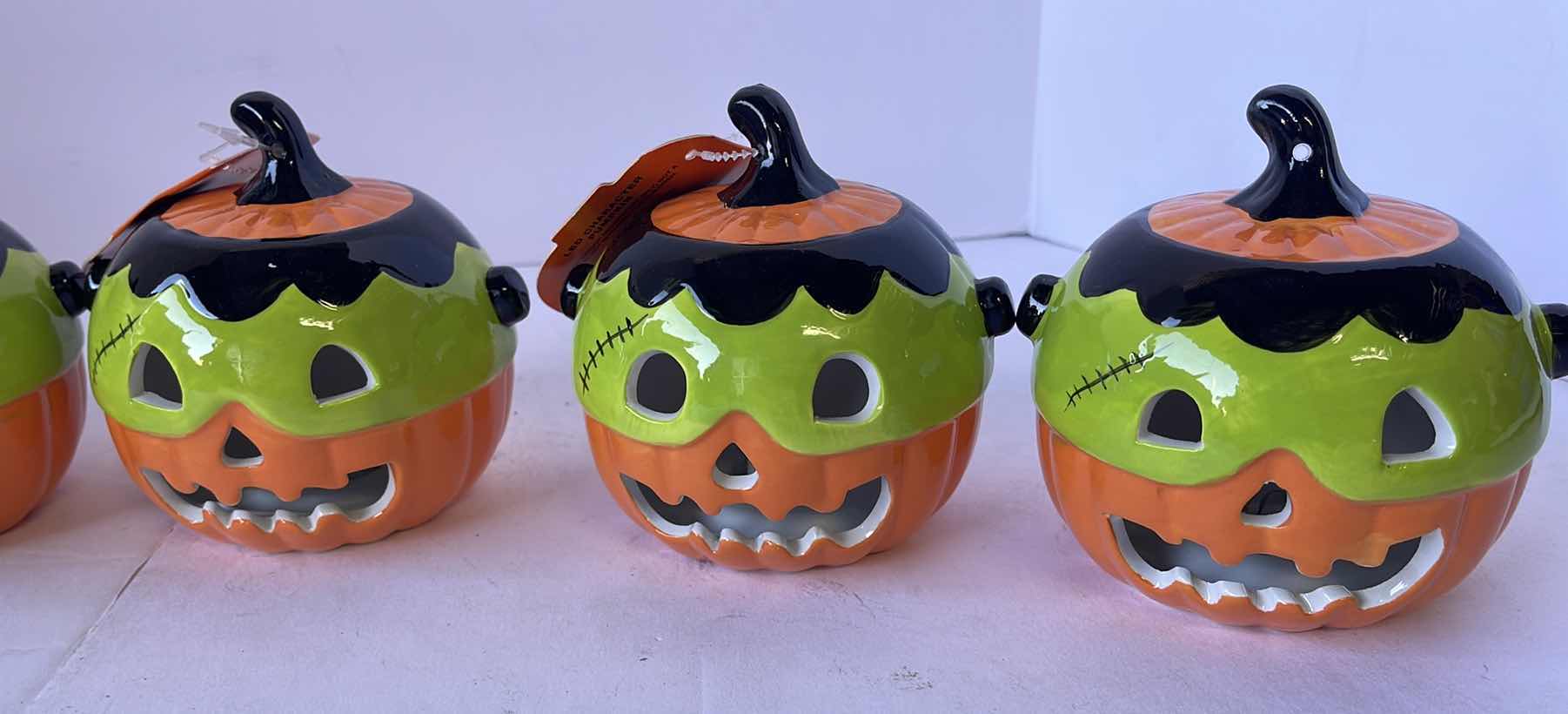 Photo 1 of HAPPY HALLOWEEN 4” MINI CERAMIC LIGHT UP PUMPKINS (6)