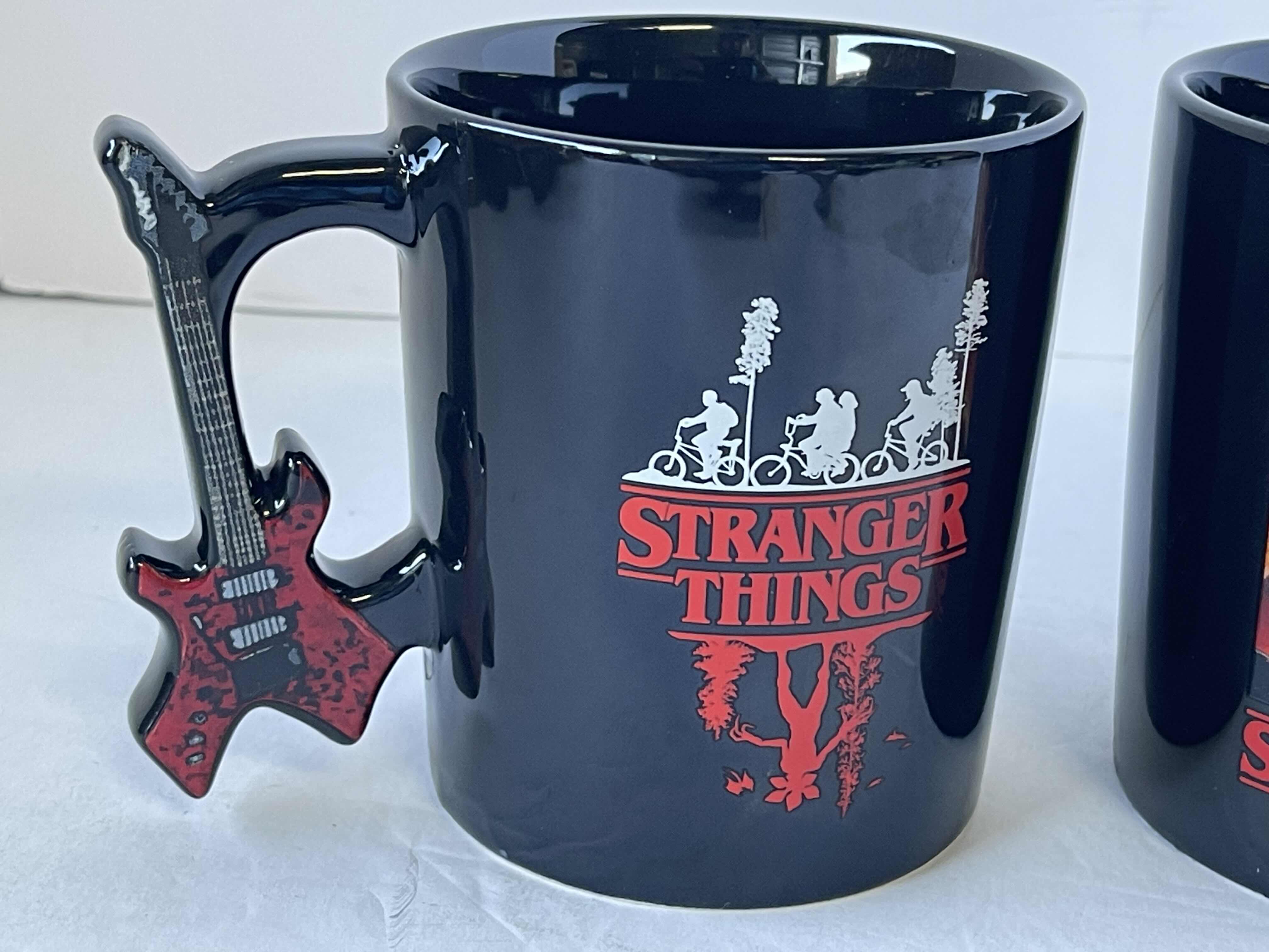 Photo 1 of STRANGER THINGS COLLECTOR CERAMIC MUGS 17.5 OZ (2)
