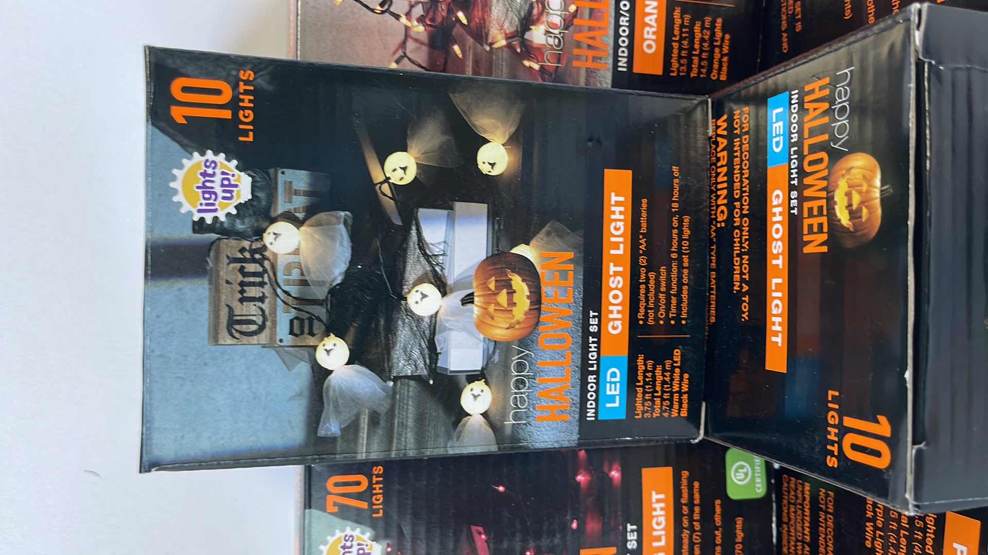 Photo 1 of HALLOWEEN LIGHT SETS (9 TOTAL) - PURPLE STRING BOX (3), ORANGE STRING BOX (3) & LED INDOOR GHOST LIGHT BOX (3)