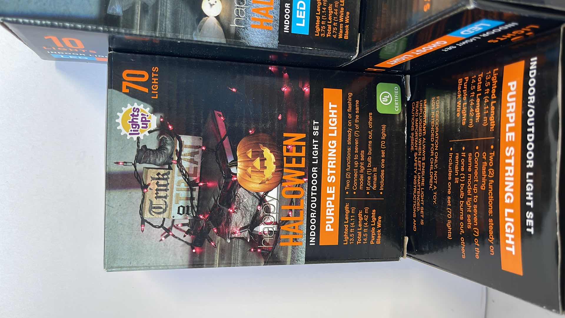 Photo 1 of HALLOWEEN LIGHT SETS (9 TOTAL) - PURPLE STRING BOX (3), ORANGE STRING BOX (3) & LED INDOOR GHOST LIGHT BOX (3)