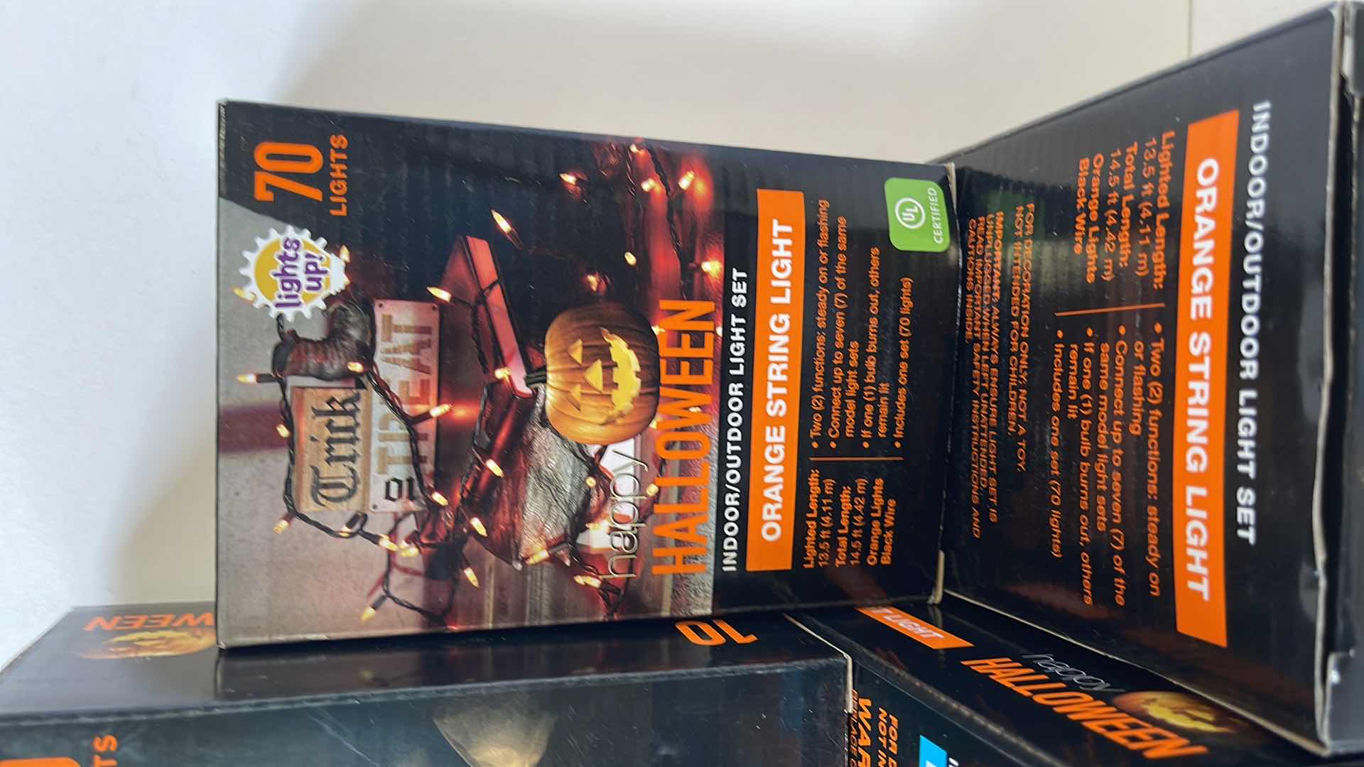 Photo 1 of HALLOWEEN LIGHT SETS (9 TOTAL) - PURPLE STRING BOX (3), ORANGE STRING BOX (3) & LED INDOOR GHOST LIGHT BOX (3)