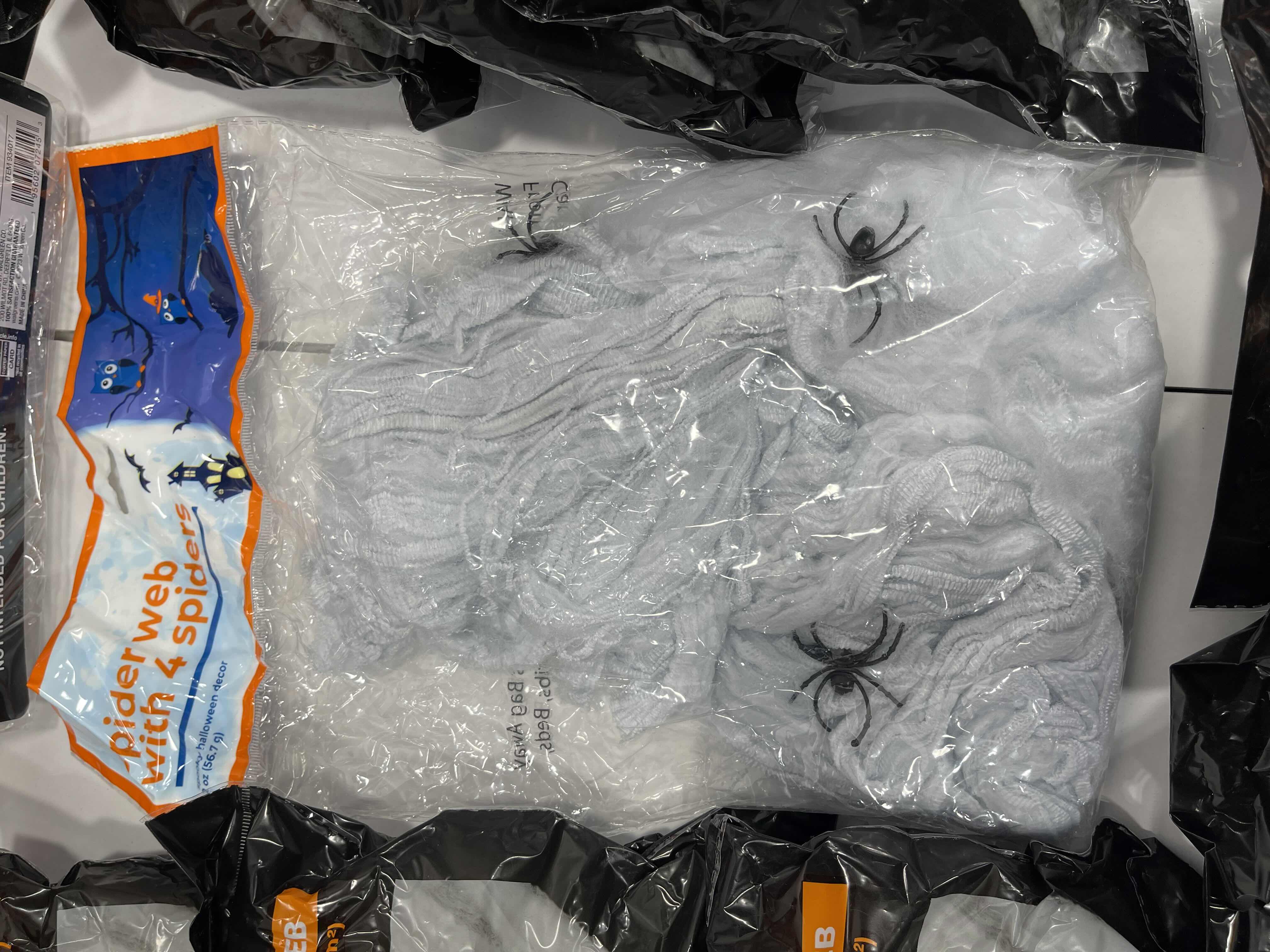 Photo 1 of SPIDER WEB LOT (9 BAGS), TINSEL SPIDER WEB 72” X 72” & FLOCKED SPIDERS (12 COUNT)